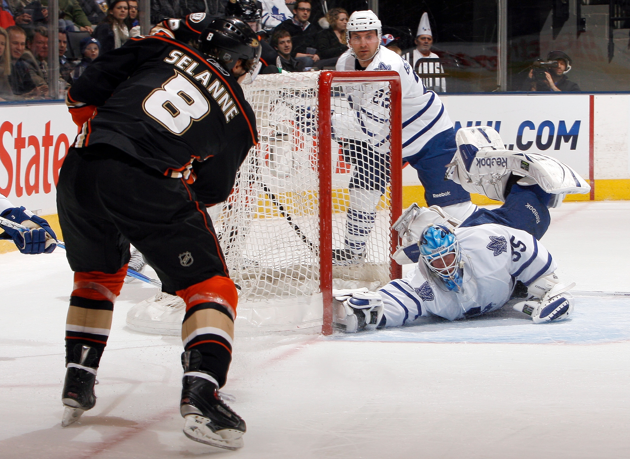 TORONTO, CANADA - JANUARY 20: Jean-Sebastien Giguere #35 of the Toronto Maple Leafs makes a huge save on Teemu Selanne #8 of the Anaheim Ducks during game action at the Air Canada Centre January 20, 2011 in Toronto, Ontario, Canada. (Photo by Abelimages/G