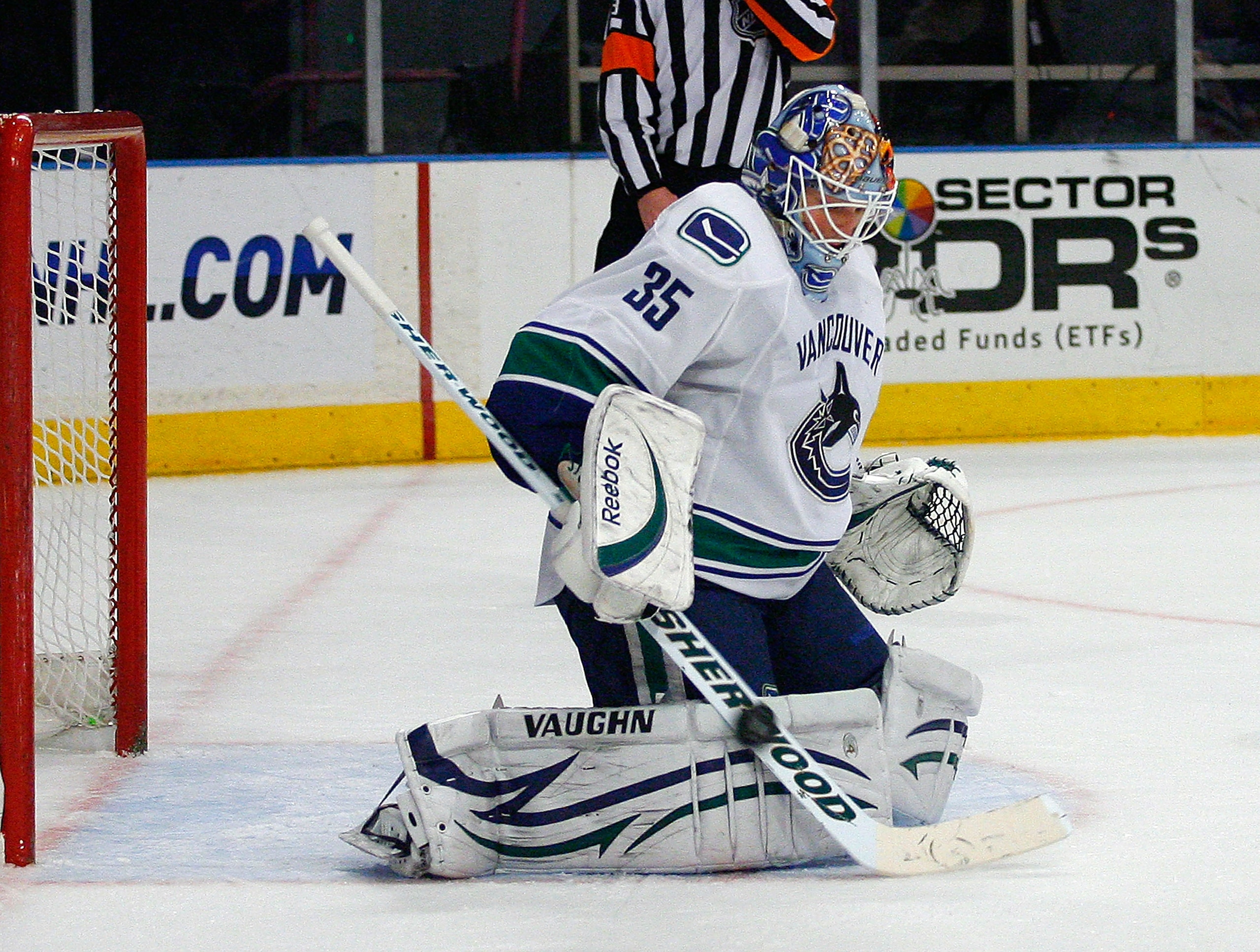 NEW YORK , NY - JANUARY 13: Goaltender Cory Schneider #35 of the Vancouver Canucks makes a stick save against the New York Rangers during the game at Madison Square Garden on January 13, 2011 in New York City. (Photo by Andy Marlin/Getty Images)