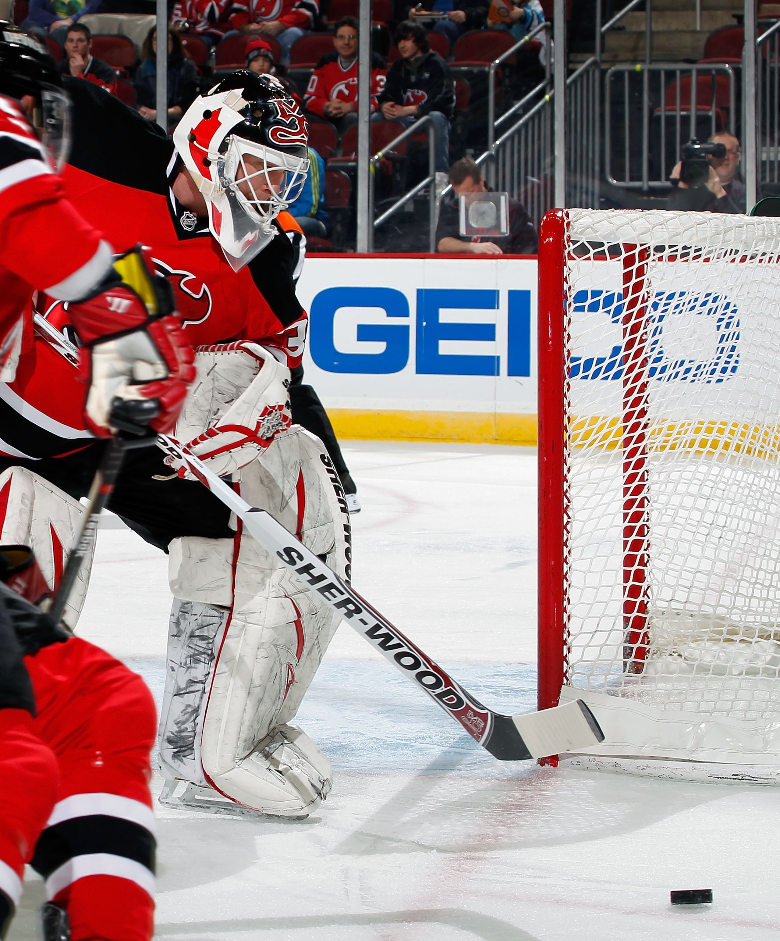 NEWARK, NJ - JANUARY 20:  Goalie Martin Brodeur #30 of the New Jersey Devils clears the puck during his shutout win in an NHL hockey game against the Pittsburgh Penguins at the Prudential Center on January 20, 2011 in Newark, New Jersey.  (Photo by Paul B