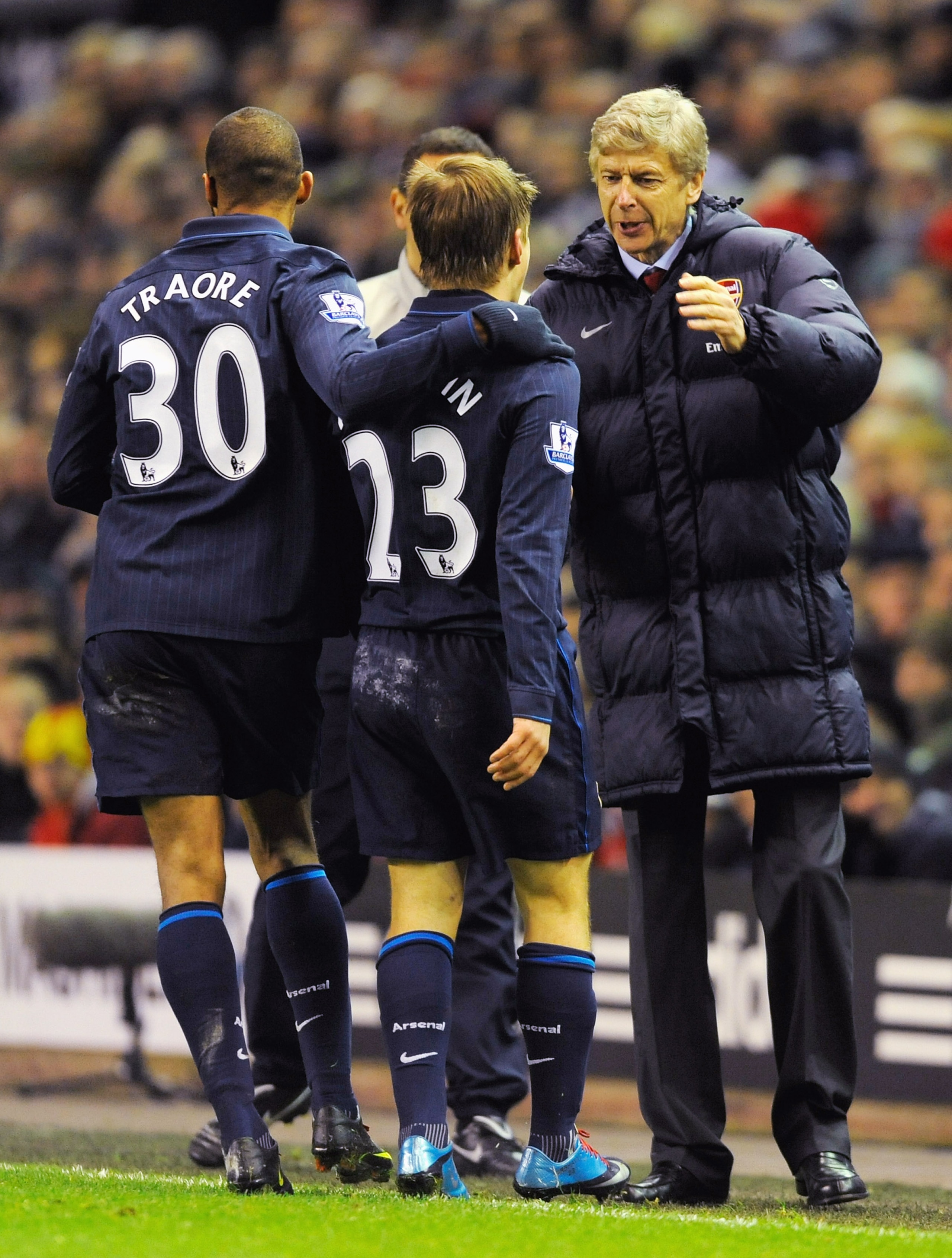 LIVERPOOL, ENGLAND - DECEMBER 13:  Andrey Arshavin of Arsenal celebrates scoring his team's second goal with Manager Arsene Wenger during the Barclays Premier League match between Liverpool and Arsenal at Anfield on December 13, 2009 in Liverpool, England