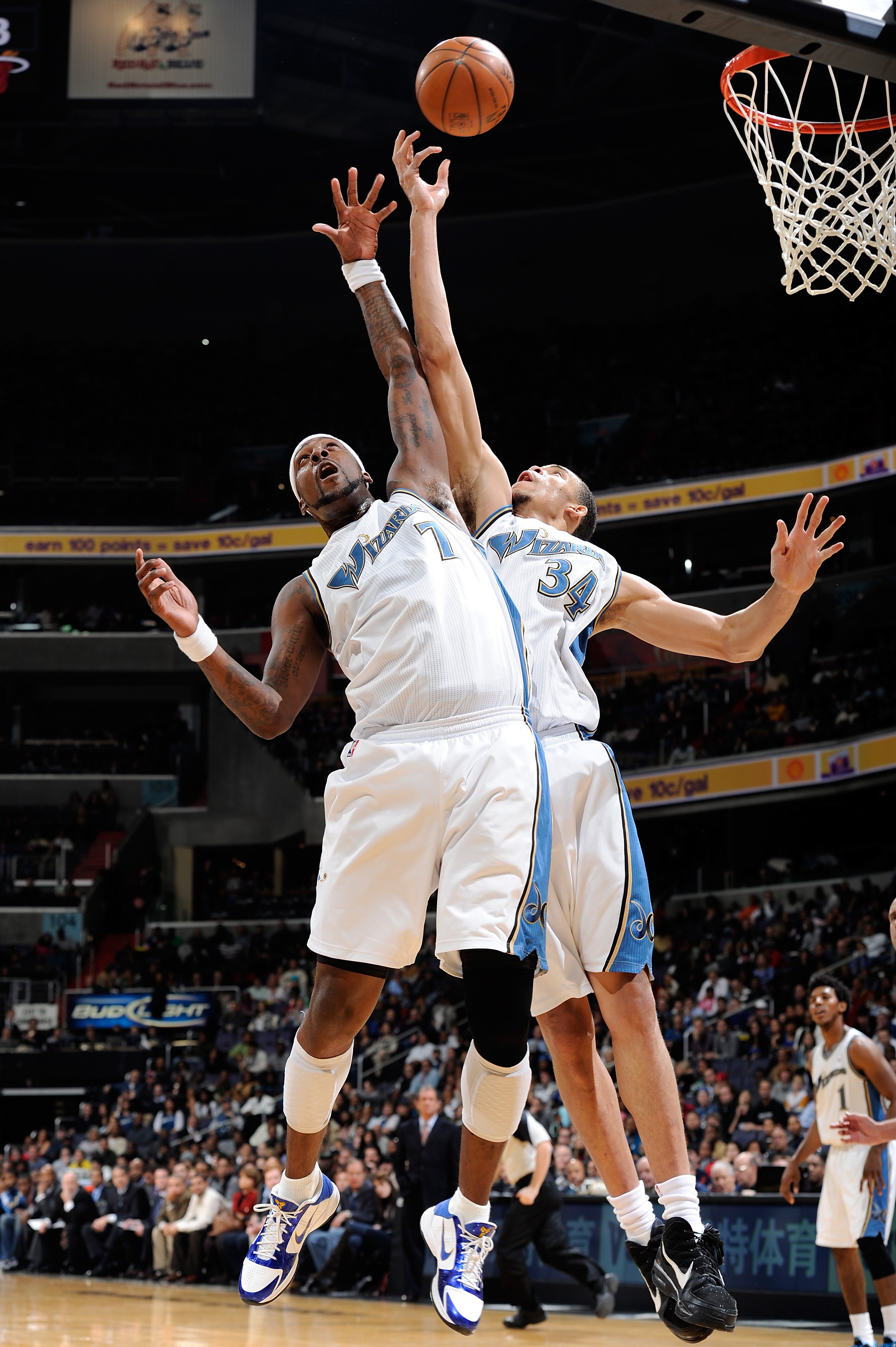 WASHINGTON, DC - DECEMBER 18:  JaVale McGee #34 and Andray Blatche #7 of the Washington Wizards jump for a rebound against the Miami Heat at the Verizon Center on December 18, 2010 in Washington, DC. NOTE TO USER: User expressly acknowledges and agrees th