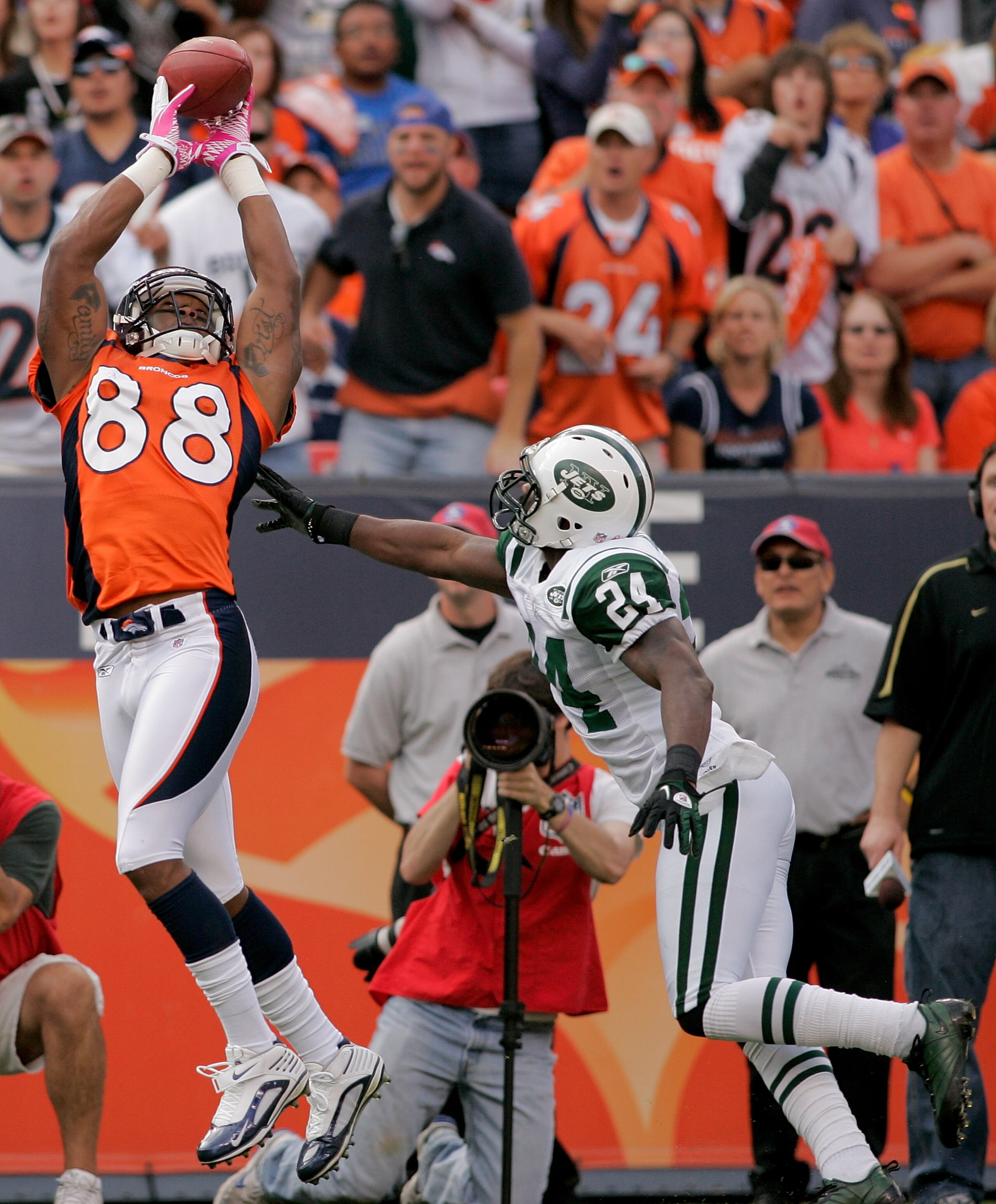 DENVER - OCTOBER 17:  Wide receiver Demaryius Thomas #88 of the Denver Broncos makes a reception for a touchdown against cornerback Darrelle Revis #24 the New York Jets at INVESCO Field at Mile High on October 17, 2010 in Denver, Colorado.  (Photo by Just
