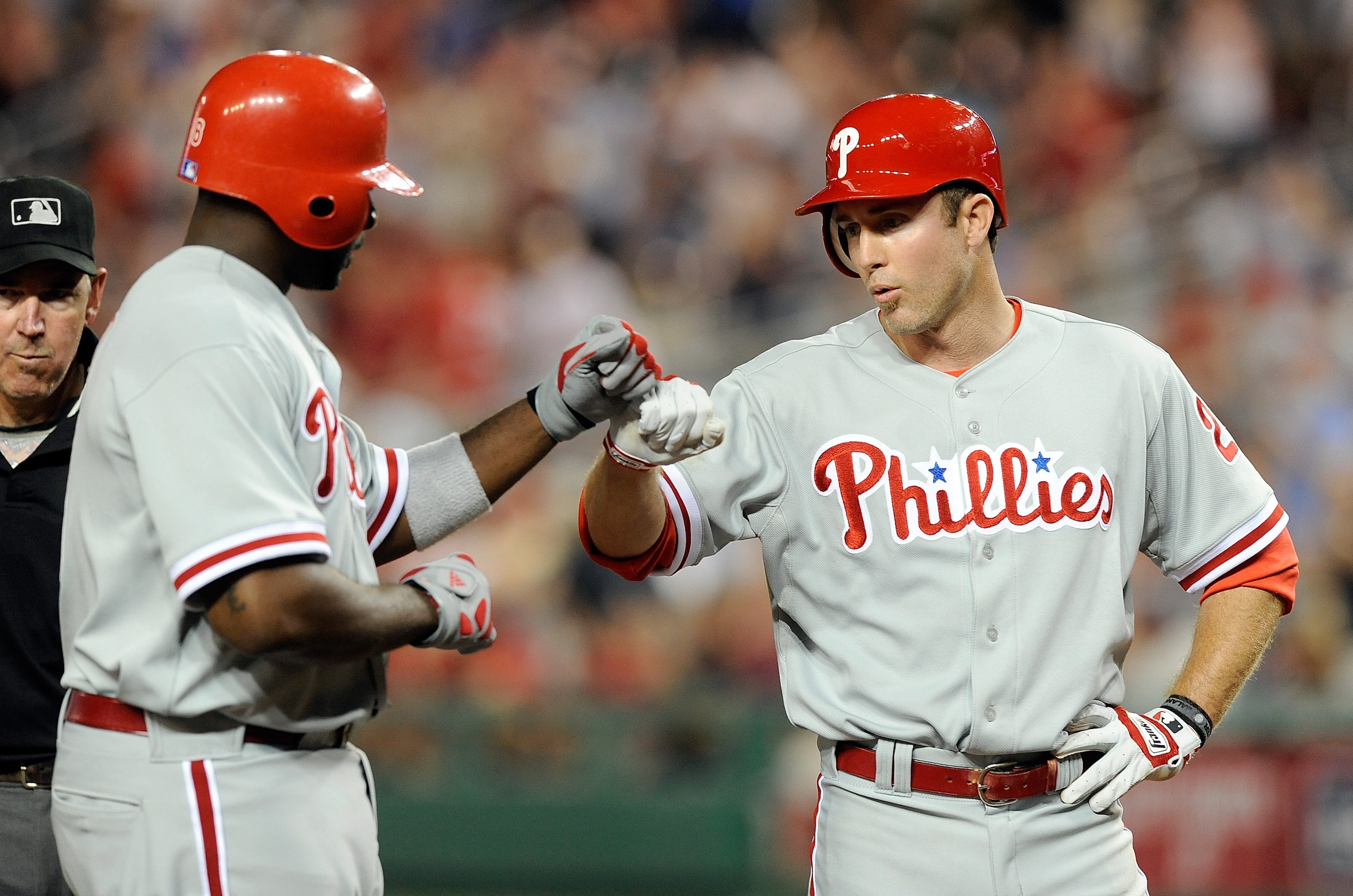 WASHINGTON - APRIL 07:  Ryan Howard #6 of the Philadelphia Phillies is congratulated by teammate Chase Utley #26 after hitting a home run in the fifth inning against the Washington Nationals at Nationals Park on April 7, 2010 in Washington, DC.  (Photo by