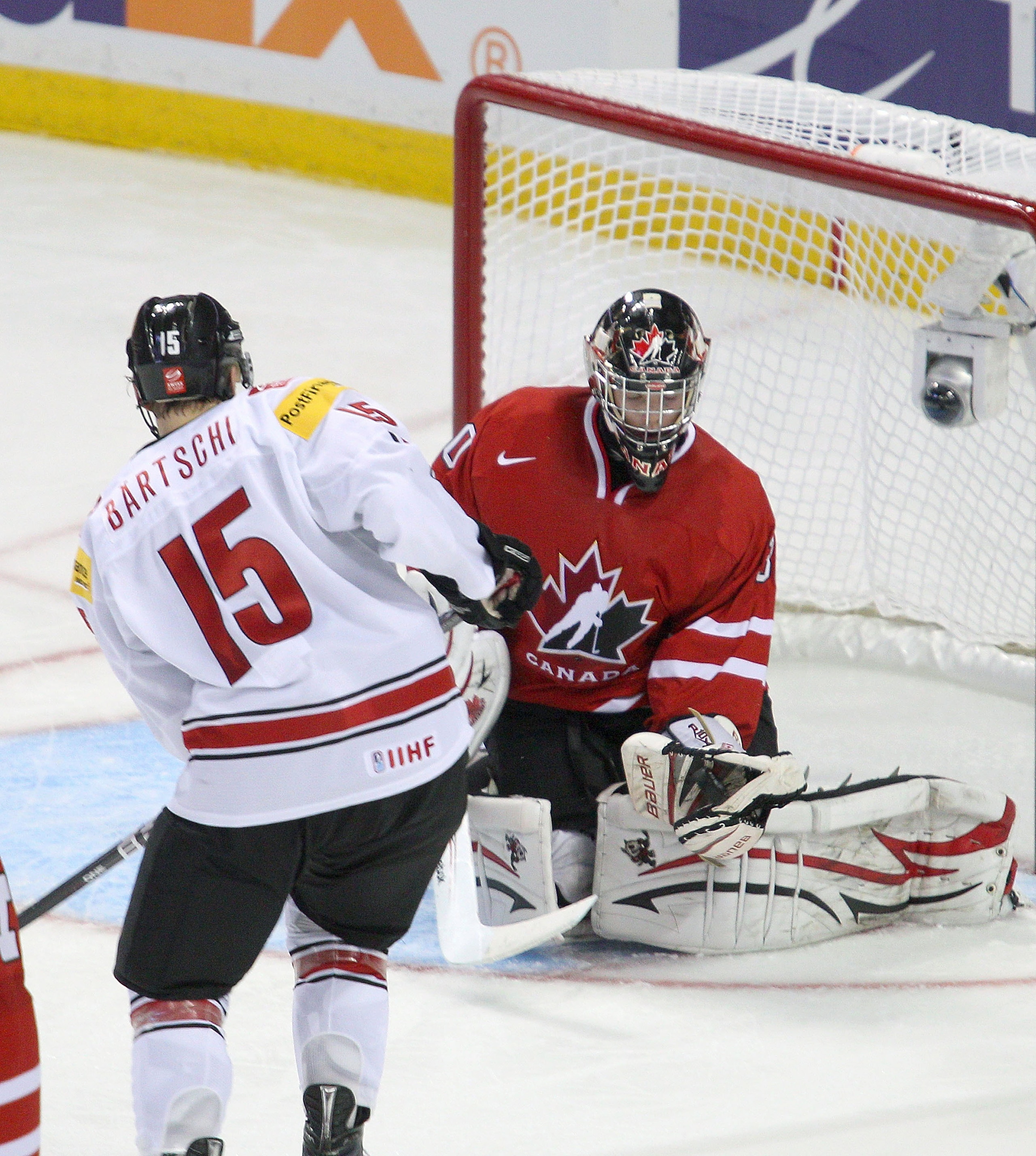 BUFFALO, NY - JANUARY 02: Mark Visentin #30 of Canada makes a save on Sven Bartschi #15 of Switzerland during the 2011 IIHF World U20 Championship game between Canada and Switzerland on January 2, 2011 in Buffalo, New York. Canada won 4-1. (Photo by Rick BUFFALO, NY - JANUARY 02: Mark Visentin #30 of Canada makes a save on Sven Bartschi #15 of Switzerland during the 2011 IIHF World U20 Championship game between Canada and Switzerland on January 2, 2011 in Buffalo, New York. Canada won 4-1. (Photo by Rick