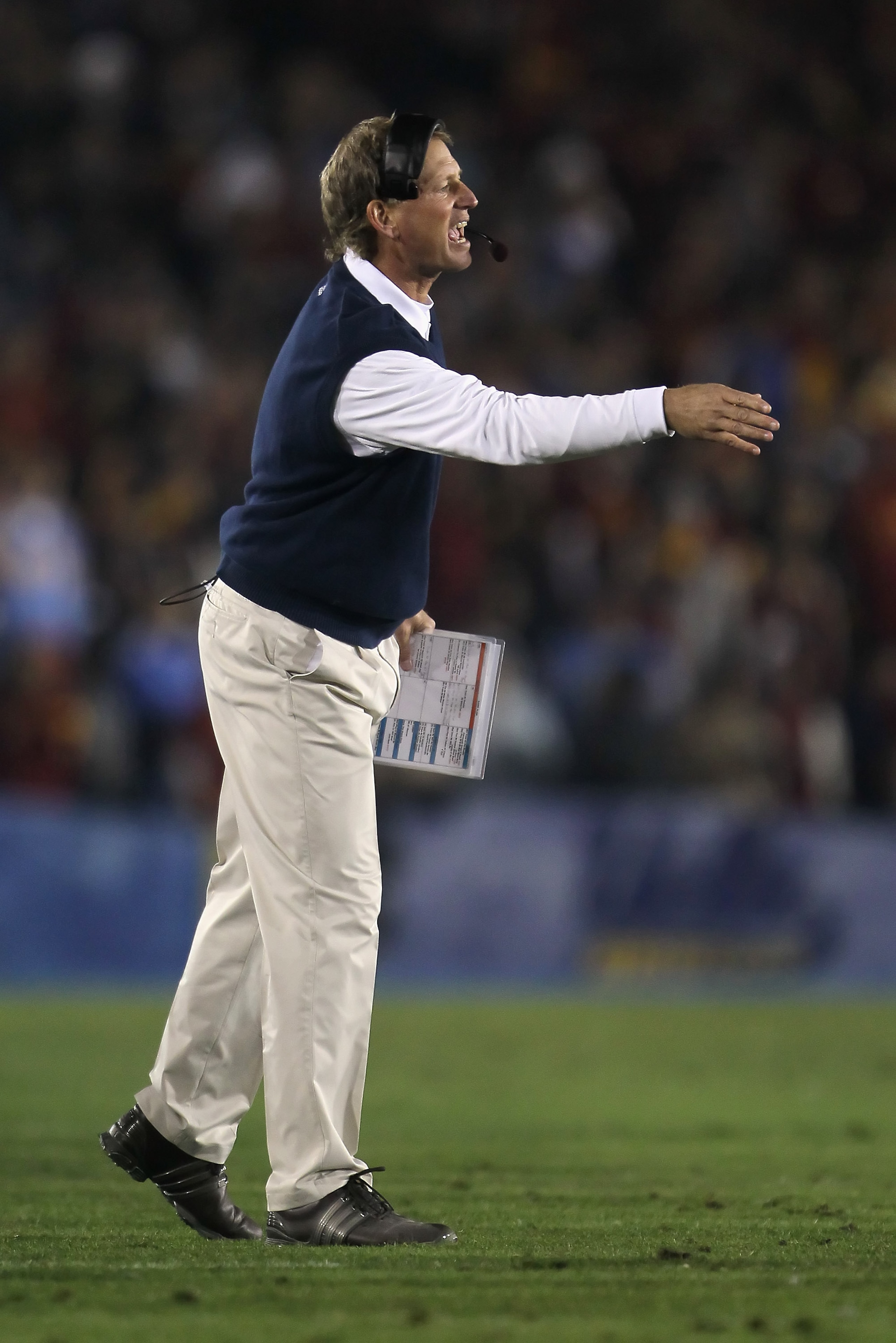 PASADENA, CA - DECEMBER 04:  UCLA Bruins head coach Rick Neuheisel yells from the sideline against the USC Trojans at the Rose Bowl on December 4, 2010 in Pasadena, California.  USC defeated UCLA 28-14. (Photo by Jeff Gross/Getty Images)