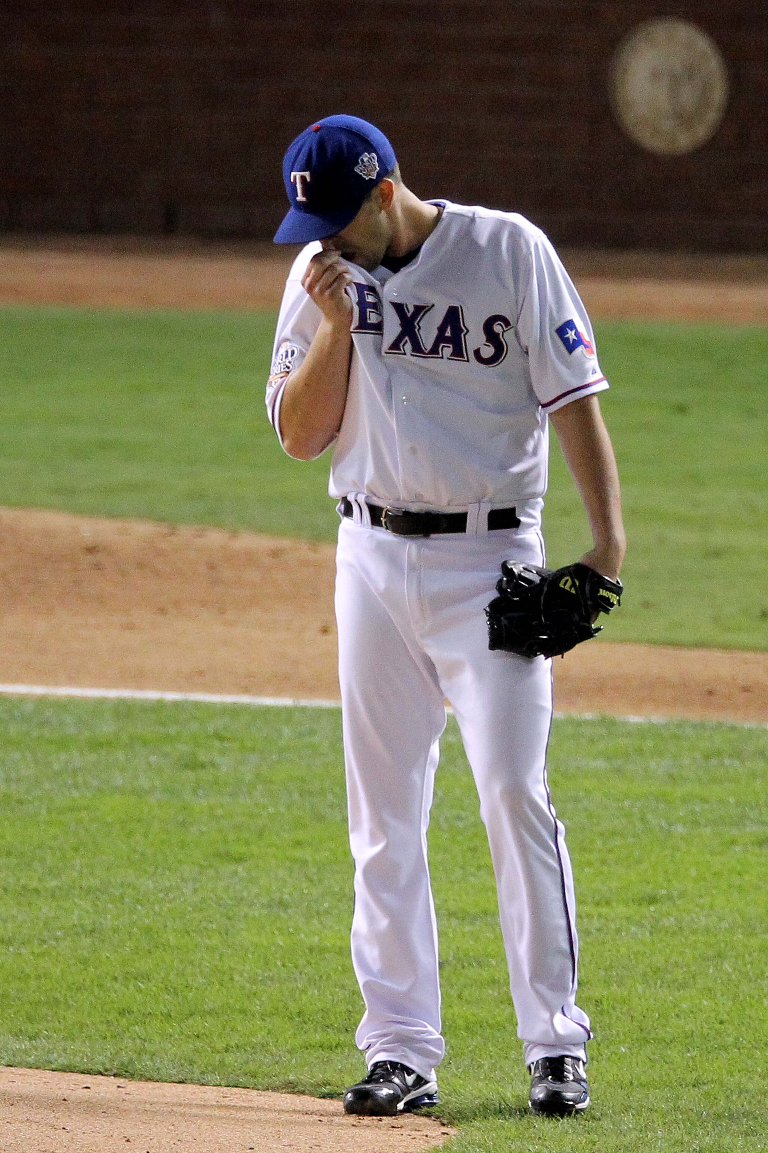 ARLINGTON, TX - OCTOBER 31:  Pitcher Darren O'Day #56 of the Texas Rangers reacts to giving up a home run against the San Francisco Giants in Game Four of the 2010 MLB World Series at Rangers Ballpark in Arlington on October 31, 2010 in Arlington, Texas.