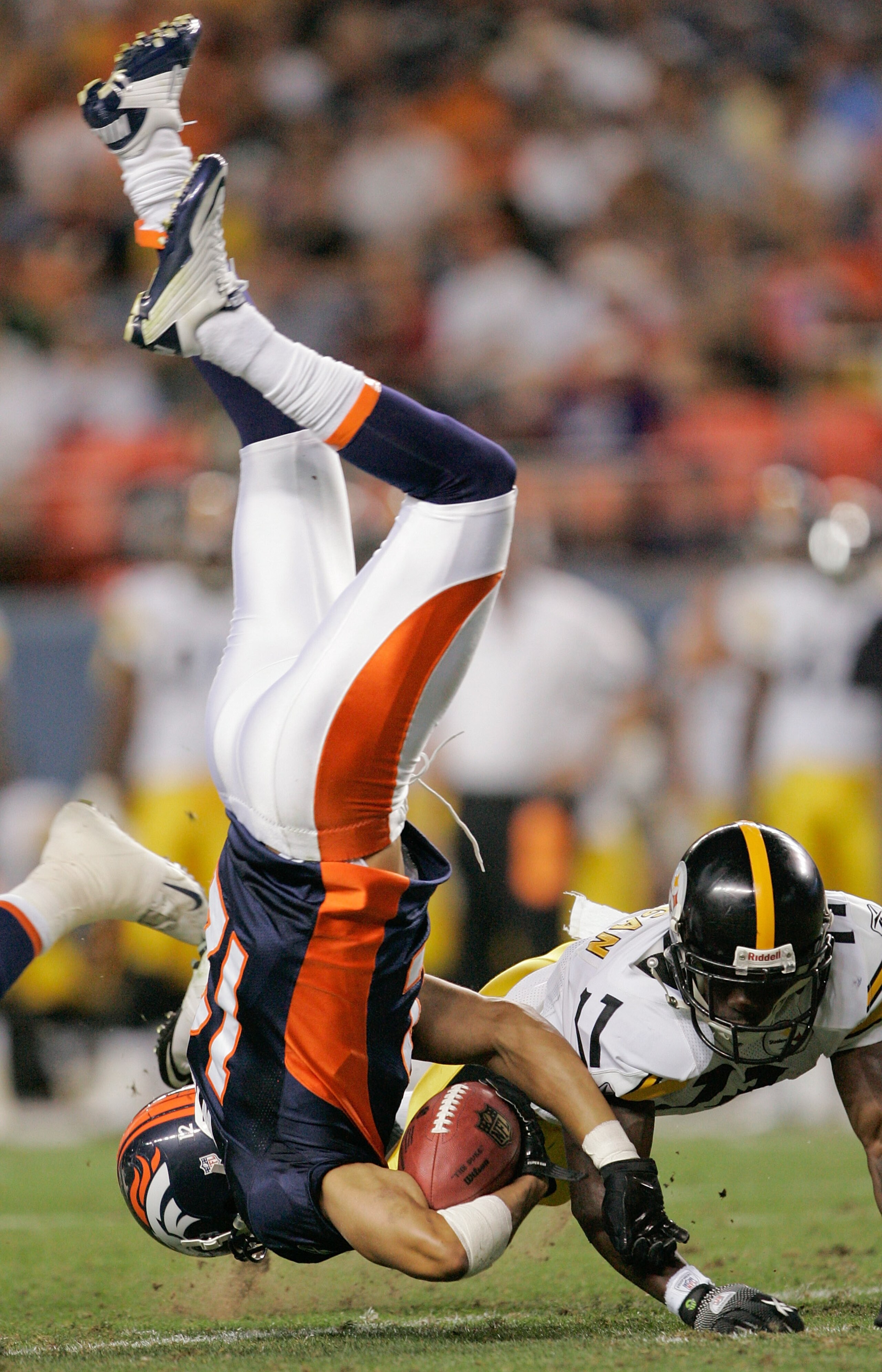 DENVER - AUGUST 29: Matt Willis #12 of the Denver Broncos is upended by running back Stefan Logan #11 of the Pittsburgh Steelers on a kickoff return in the fourth quarter at INVESCO Field at Mile High on August 29, 2010 in Denver, Colorado.  (Photo by Jus