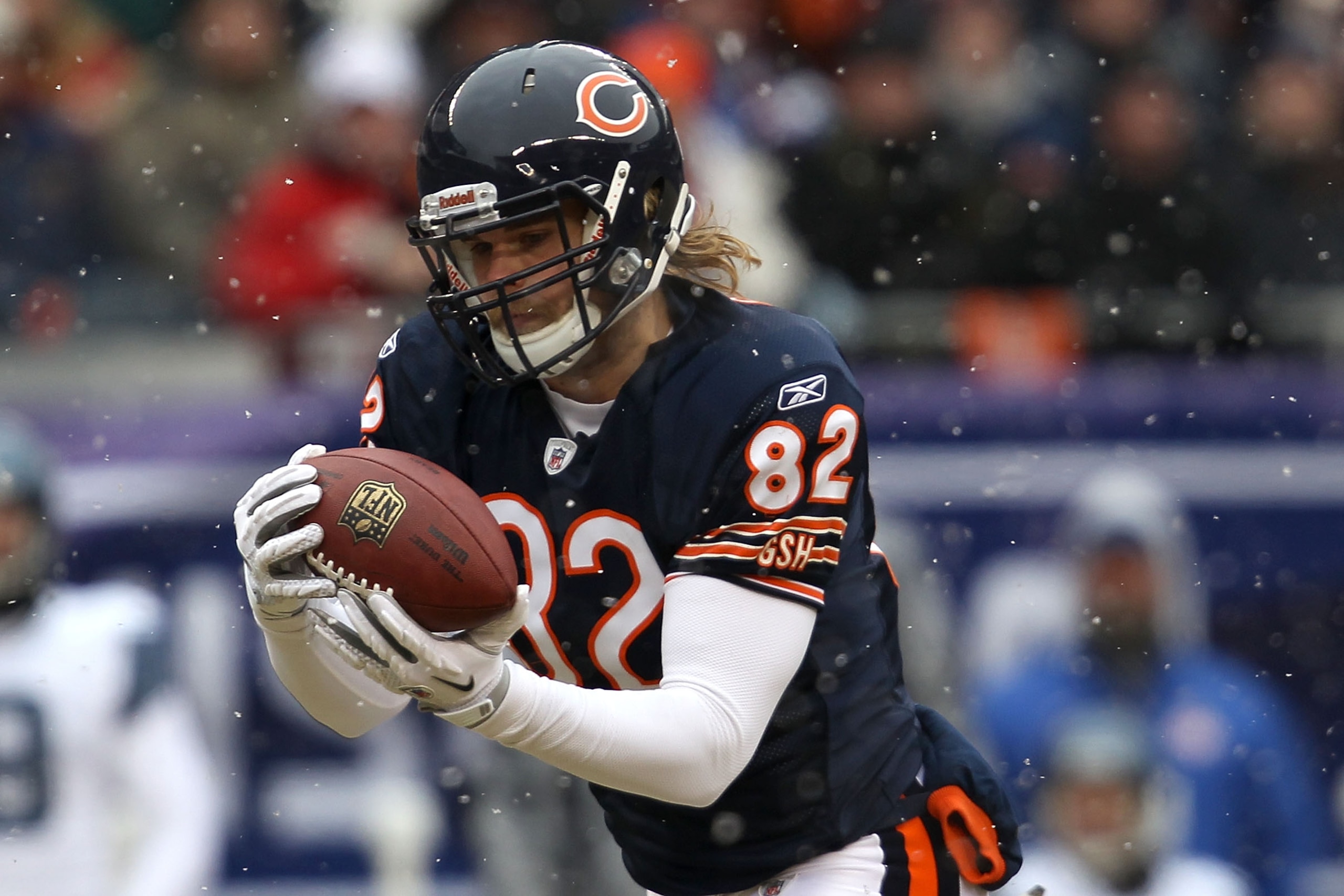 CHICAGO, IL - JANUARY 16:  Tight end Greg Olsen #82 of the Chicago Bears catches a 58-yard touchdown in the first quarter in front of Lawyer Milloy #36 of the Seattle Seahawks in the 2011 NFC divisional playoff game at Soldier Field on January 16, 2011 in