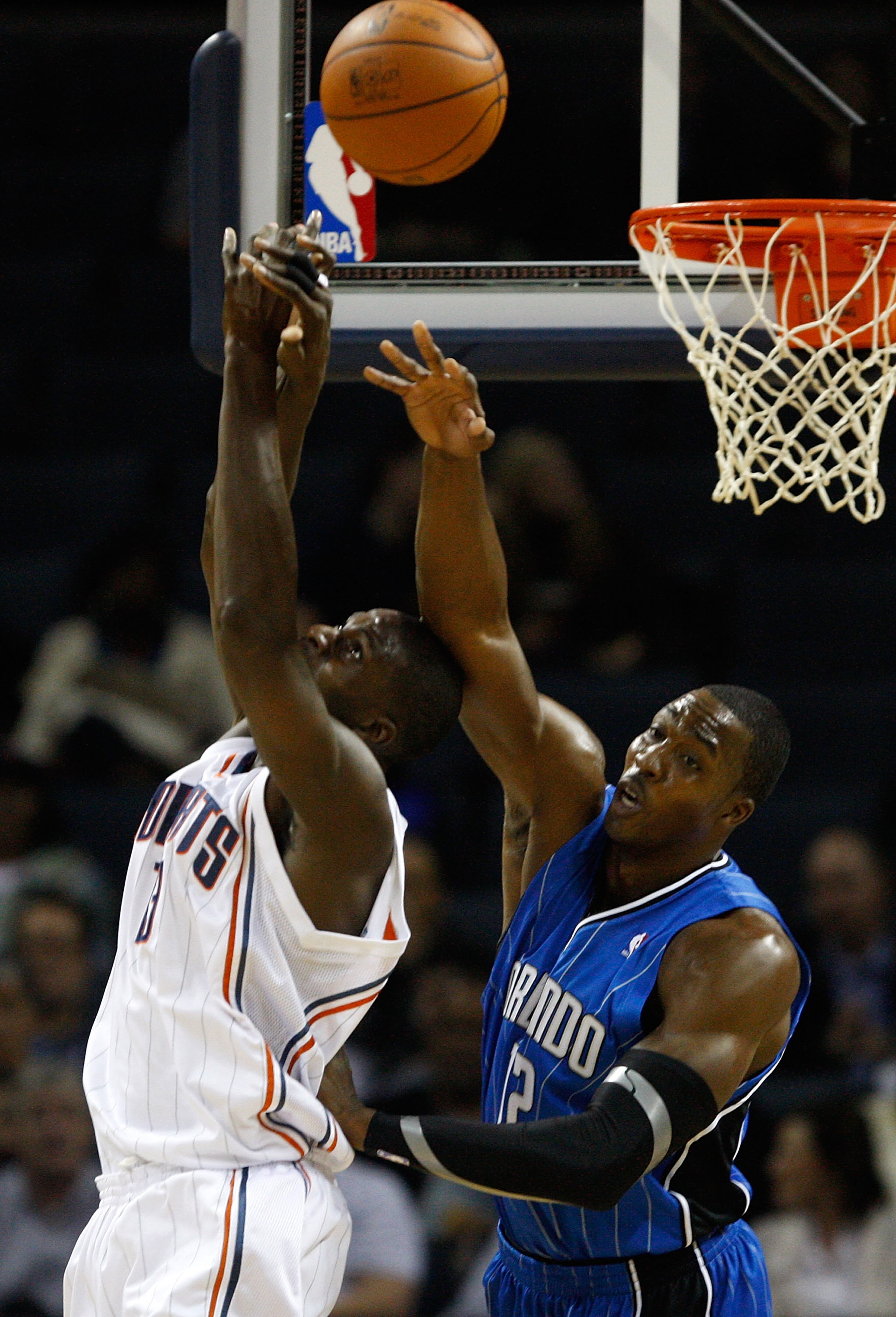 CHARLOTTE, NC - NOVEMBER 10: Dwight Howard #12 of the Orlando Magic knocks the ball away from Nazr Mohammed #13 of the Charlotte Bobcats during their game at Time Warner Cable Arena on November 10, 2009 in Charlotte, North Carolina. (Photo by Streeter L CHARLOTTE, NC - NOVEMBER 10: Dwight Howard #12 of the Orlando Magic knocks the ball away from Nazr Mohammed #13 of the Charlotte Bobcats during their game at Time Warner Cable Arena on November 10, 2009 in Charlotte, North Carolina. (Photo by Streeter L