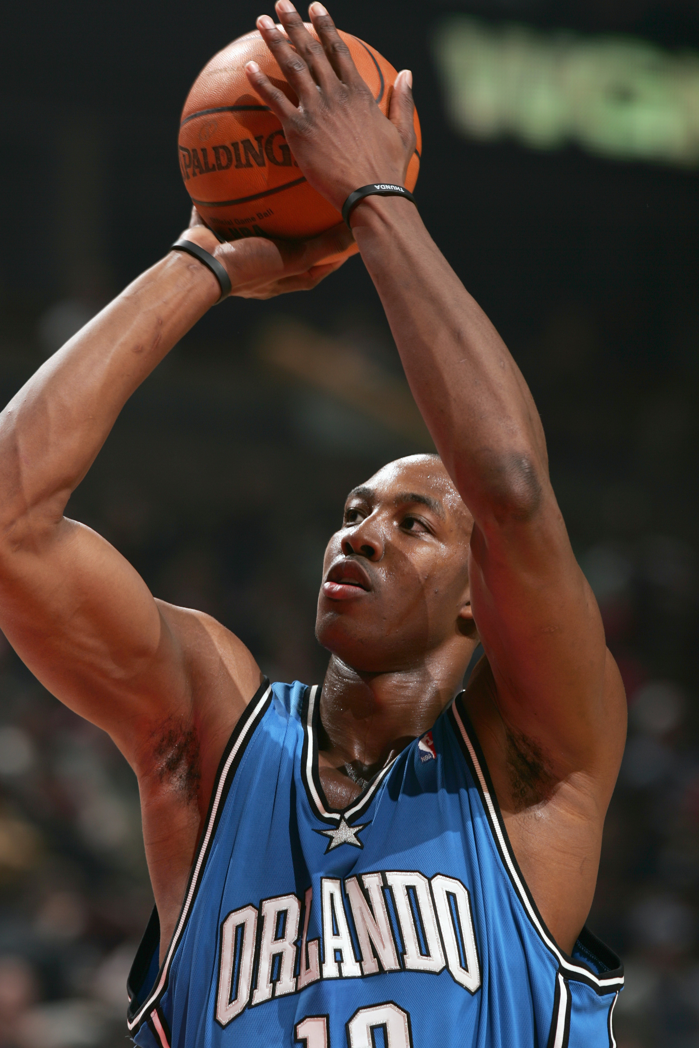 CHICAGO - MARCH 28: Dwight Howard #12 of the Orlando Magic takes a shot during the game against the Chicago Bulls on March 28, 2006 at the United Center in Chicago, Illinois. The Magic defeated the Bulls 97-93.  NOTE TO USER: User expressly acknowledges a