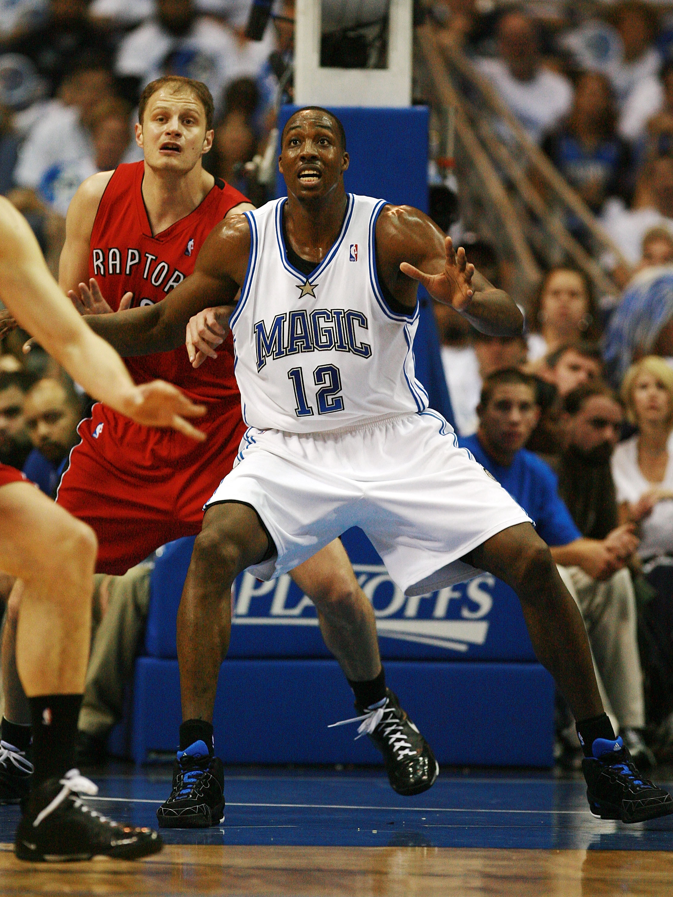 ORLANDO, FL - APRIL 20:  Rasho Nesterovic #12 of the Toronto Raptors battles for position with Dwight Howard #12 of the Orlando Magic in Game One of the Eastern Conference Quarterfinals during the 2008 NBA Playoffs at the Amway Arena on April 20, 2008 in 