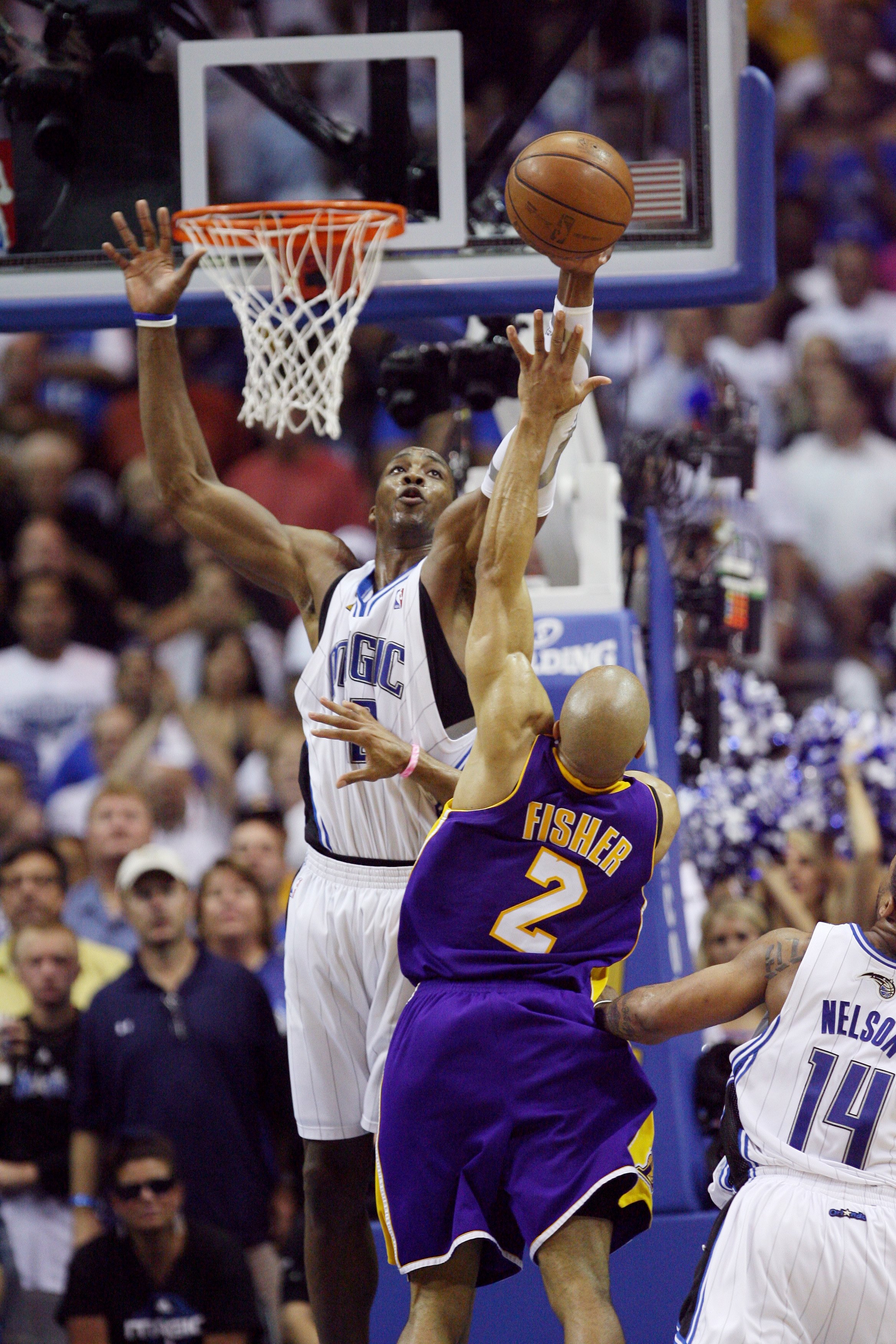 ORLANDO, FL - JUNE 11:  Dwight Howard #12 of the Orlando Magic goes up to block a shot by Derek Fisher #2  of the Los Angeles Lakers in Game Four of the 2009 NBA Finals at Amway Arena on June 11, 2009 in Orlando, Florida.  The Lakers won 99-91 in overtime