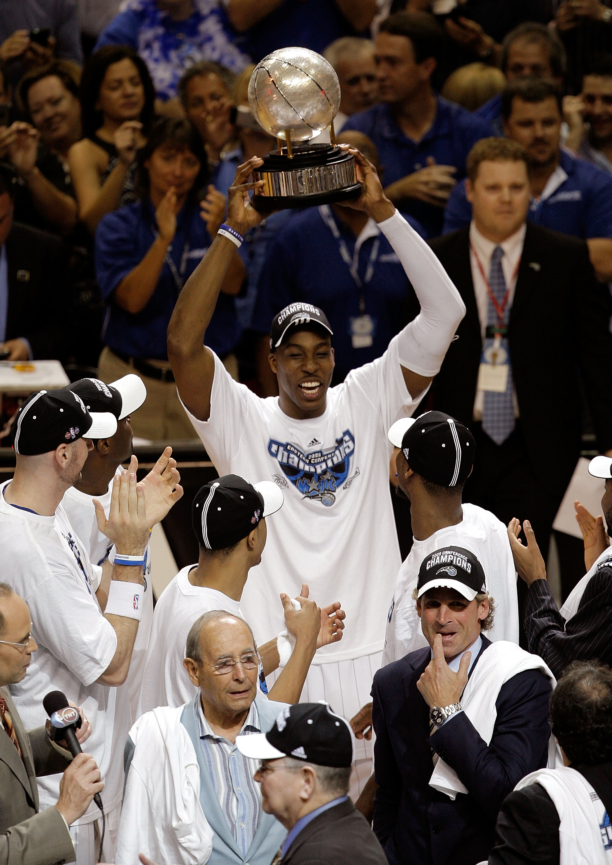 ORLANDO, FL - MAY 30: Dwight Howard #12 of the Orlando Magic holds up the trophy after defeating the Cleveland Cavaliers in Game Six of the Eastern Conference Finals during the 2009 Playoffs at Amway Arena on May 30, 2009 in Orlando, Florida. NOTE TO USER