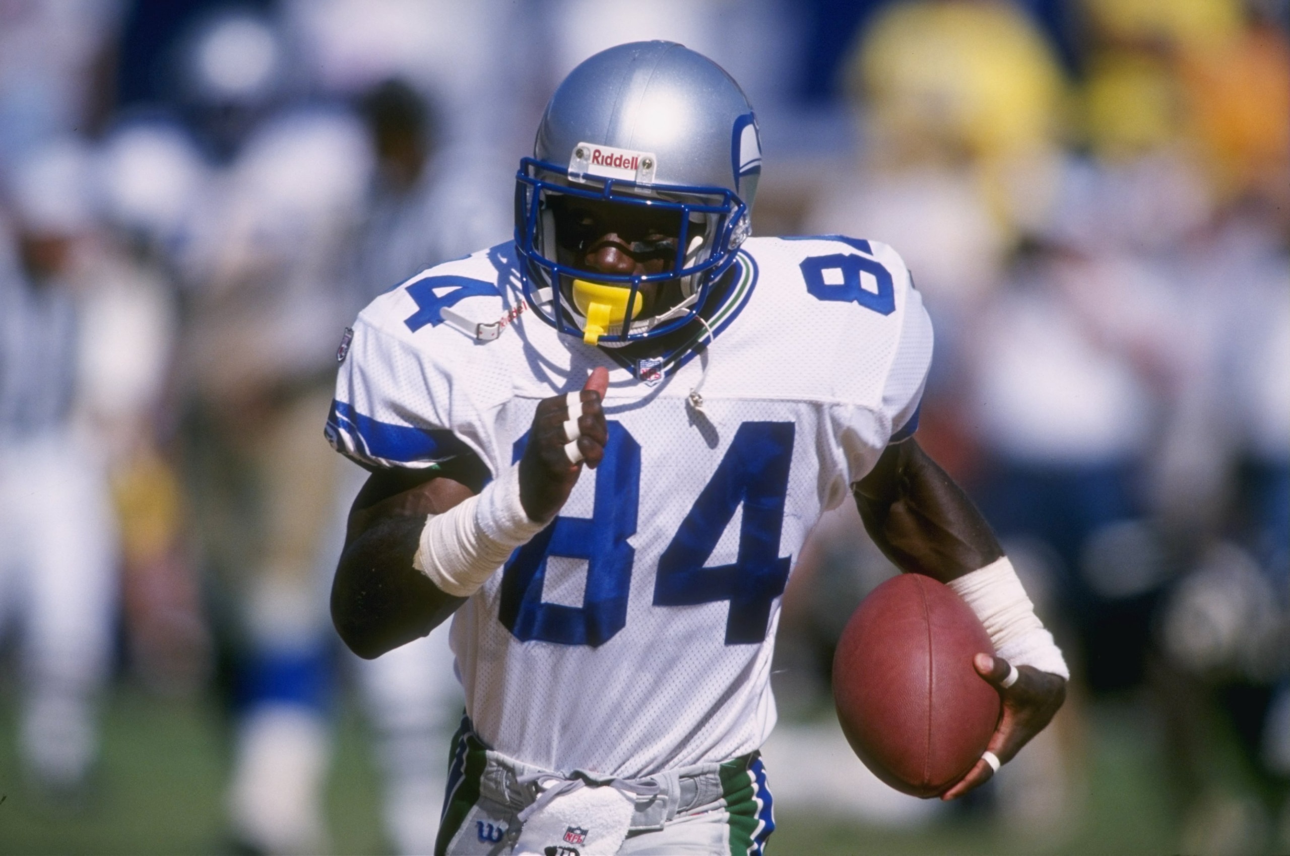1 Sep 1996: Wide receiver Joey Galloway of the Seattle Seahawks looks up field as he runs with the ball after a reception in the Seahawks 29-7 loss to the San Diego Chargers at Jack Murphy Stadium in San Diego, California.  Mandatory Credit: Al Bello  /Al