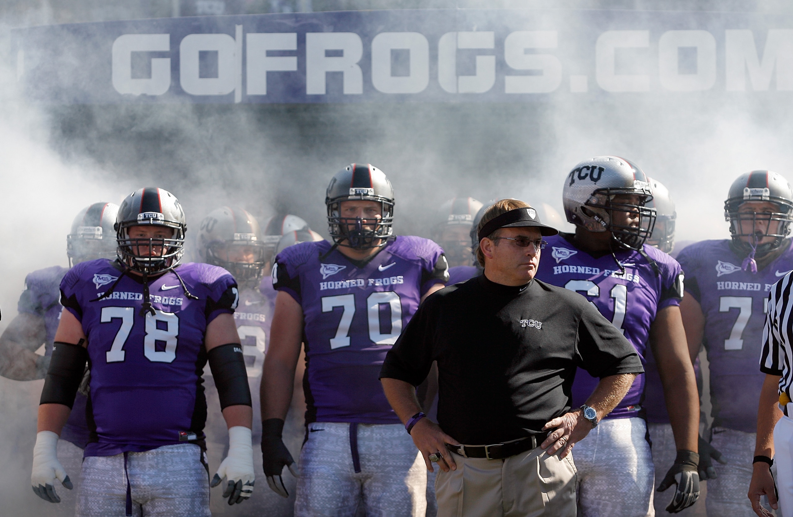 FORT WORTH, TX - OCTOBER 16: Head coach Gary Patterson of the TCU Horned Frogs takes to the field with offensive guard Josh Vernon #78 and tackle Zach Roth #70 against the BYU Cougars at Amon G. Carter Stadium on October 16, 2010 in Fort Worth, Texas. ( FORT WORTH, TX - OCTOBER 16: Head coach Gary Patterson of the TCU Horned Frogs takes to the field with offensive guard Josh Vernon #78 and tackle Zach Roth #70 against the BYU Cougars at Amon G. Carter Stadium on October 16, 2010 in Fort Worth, Texas. (