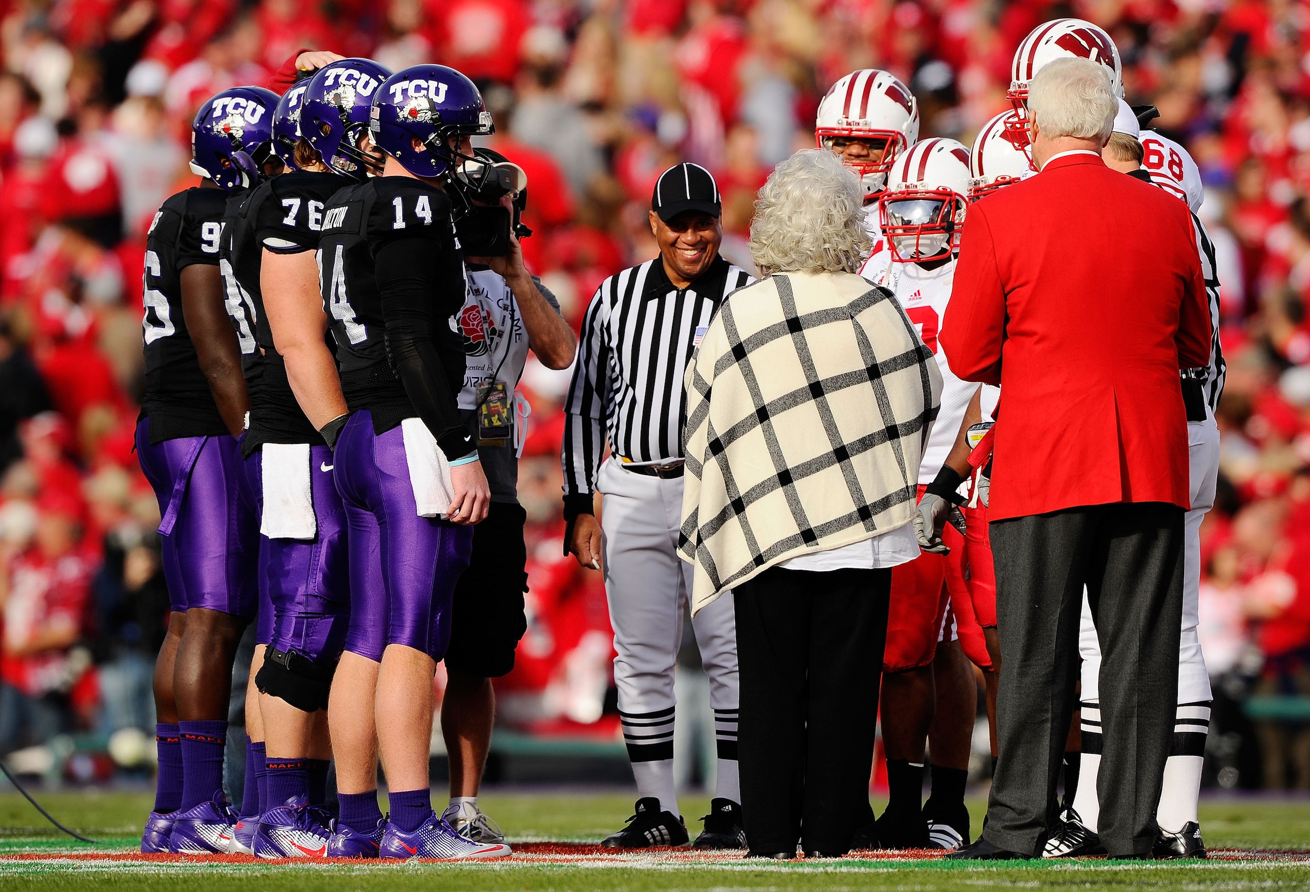 PASADENA, CA - JANUARY 01: A view of the coin-flip between the Wisconsin Badgers and the TCU Horned Frogs in the 97th Rose Bowl game on January 1, 2011 in Pasadena, California. (Photo by Kevork Djansezian/Getty Images) PASADENA, CA - JANUARY 01: A view of the coin-flip between the Wisconsin Badgers and the TCU Horned Frogs in the 97th Rose Bowl game on January 1, 2011 in Pasadena, California. (Photo by Kevork Djansezian/Getty Images)