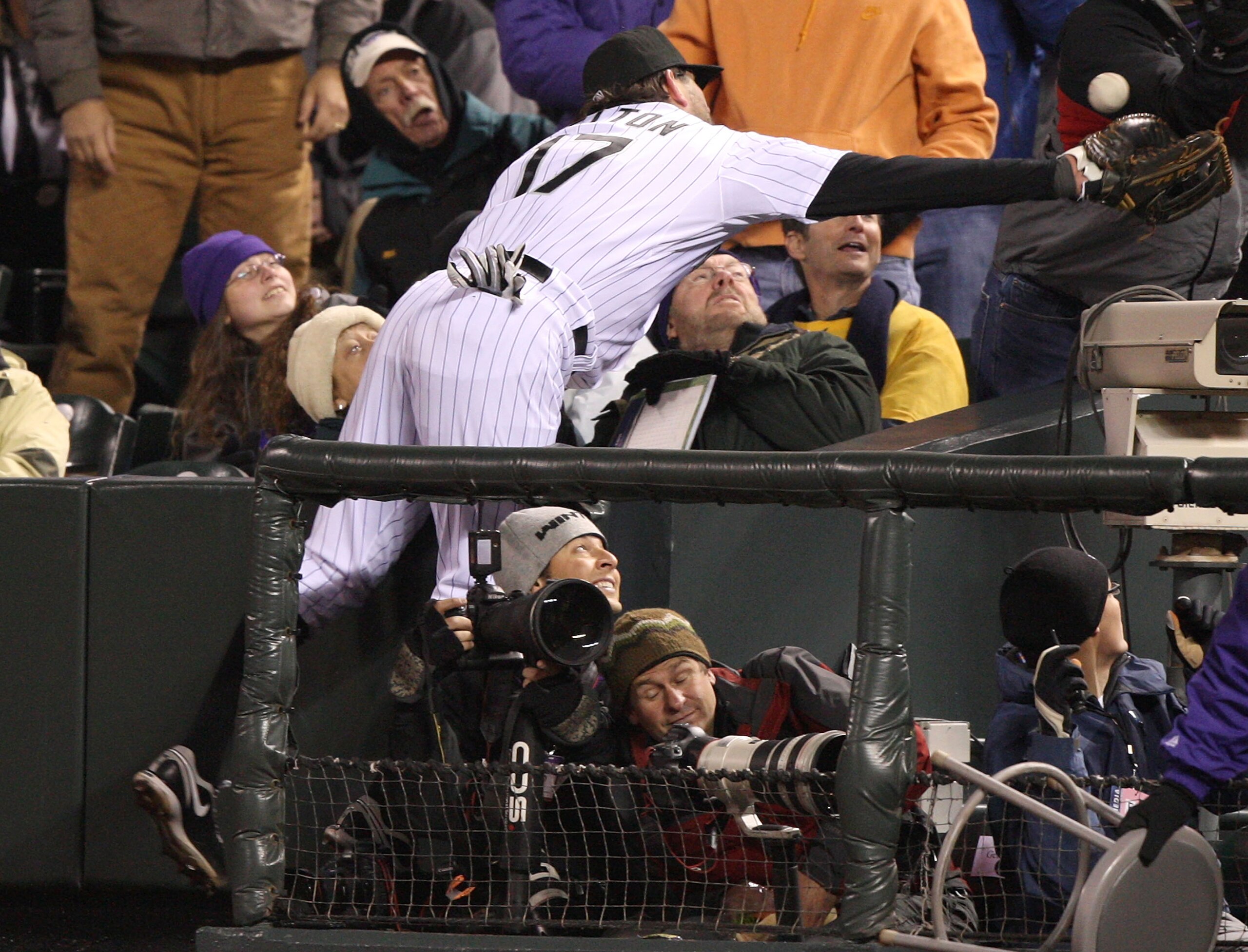 DENVER - OCTOBER 11: Todd Helton #17 of the Colorado Rockies fails to reach a foul ball against the Philadelphia Phillies in Game Three of the NLDS during the 2009 MLB Playoffs at Coors Field on October 11, 2009 in Denver, Colorado. (Photo by Jed Jacobsoh