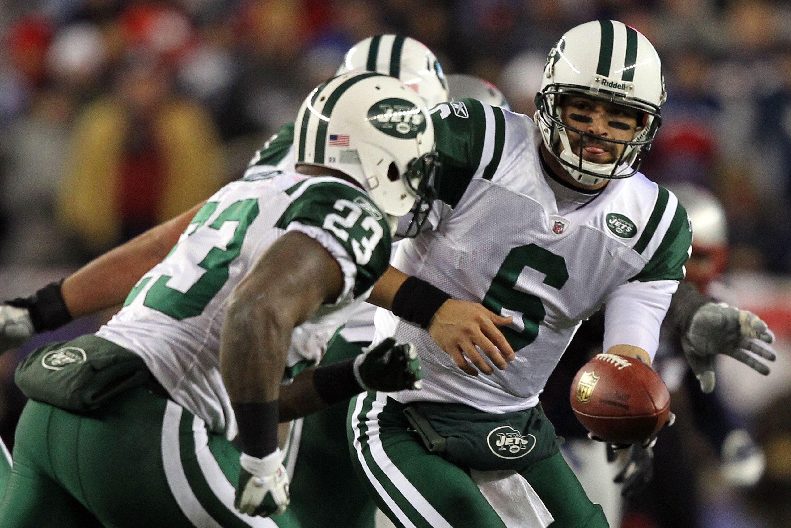 FOXBORO, MA - JANUARY 16:  Mark Sanchez #6 drops back with Shonn Greene #23 of the New York Jets during their 2011 AFC divisional playoff game against the New England Patriots at Gillette Stadium on January 16, 2011 in Foxboro, Massachusetts.  (Photo by A