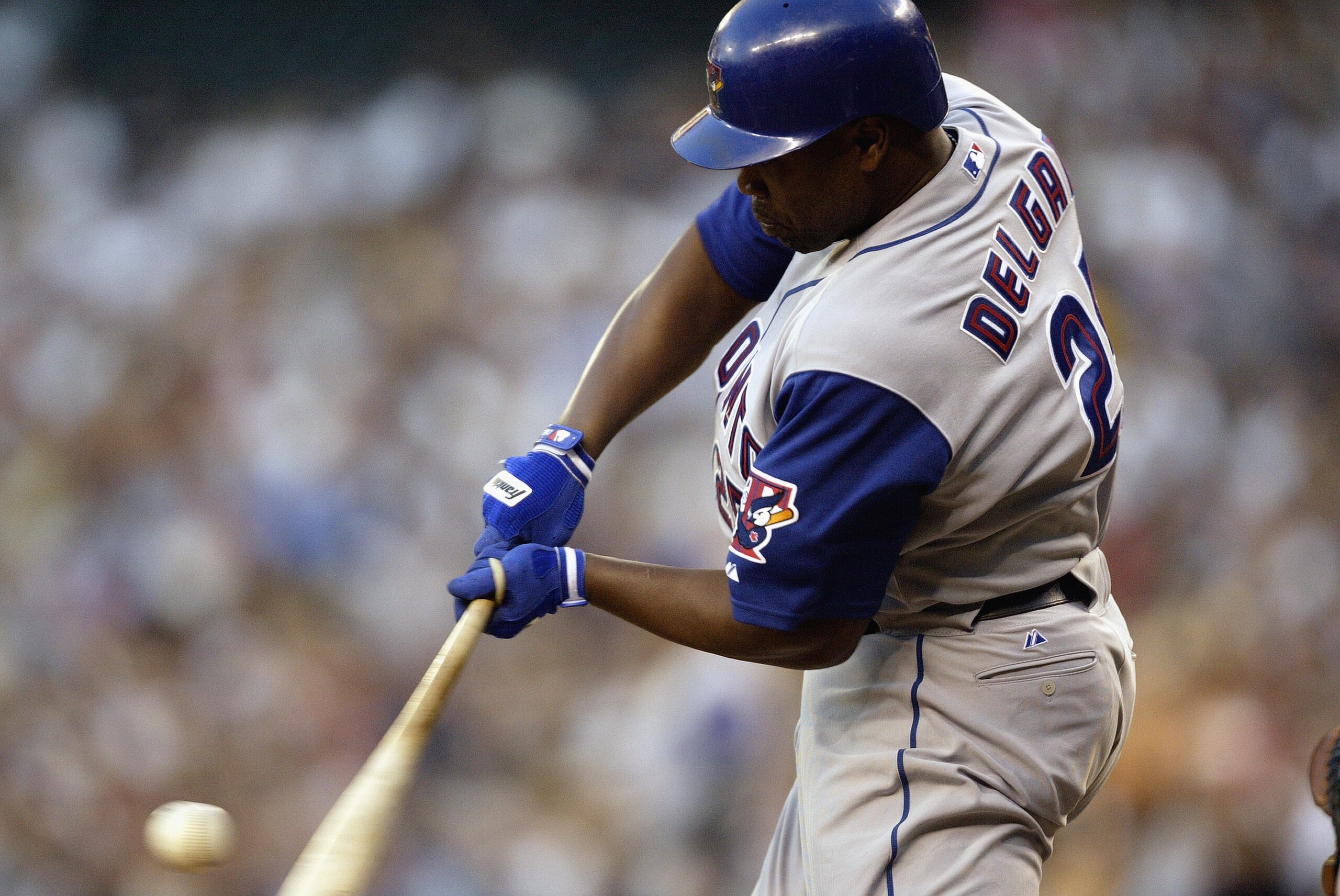 SEATTLE - AUGUST 13:  Carlos Delgado #25 of the Toronto Blue Jays swings at the ball against the Seattle Mariners during the game on August 13, 2003 at Safeco Field in Seattle, Washington.  The Mariners defeated the Blue Jays 13-6.  (Photo by Otto Greule