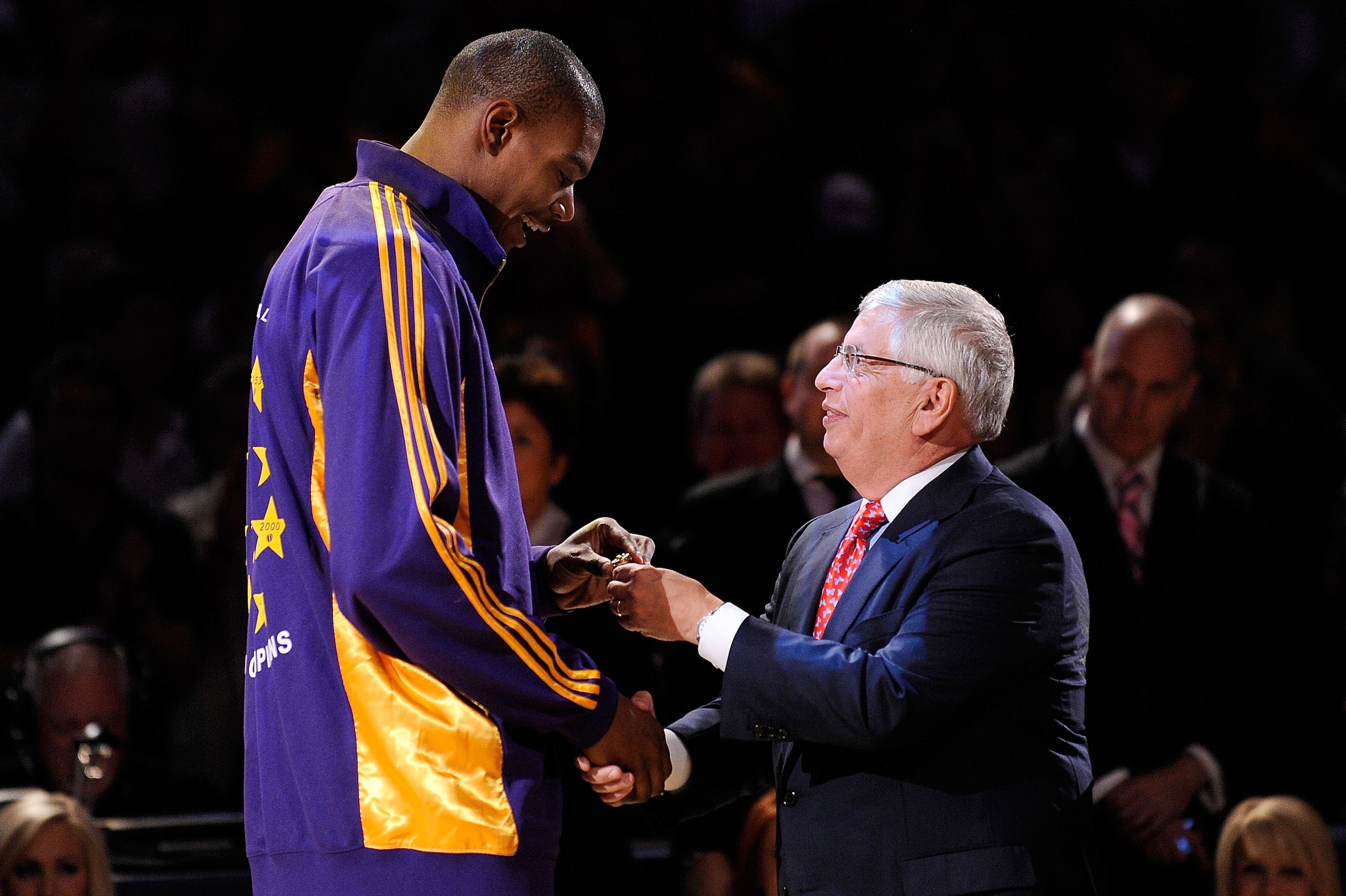 LOS ANGELES, CA - OCTOBER 27:  Andrew Bynum #17 of the Los Angeles Lakers receives his 2009 NBA Championship ring from NBA Commissioner David Stern before the season opening game against the Los Angeles Clippers at Staples Center on October 27, 2009 in Lo