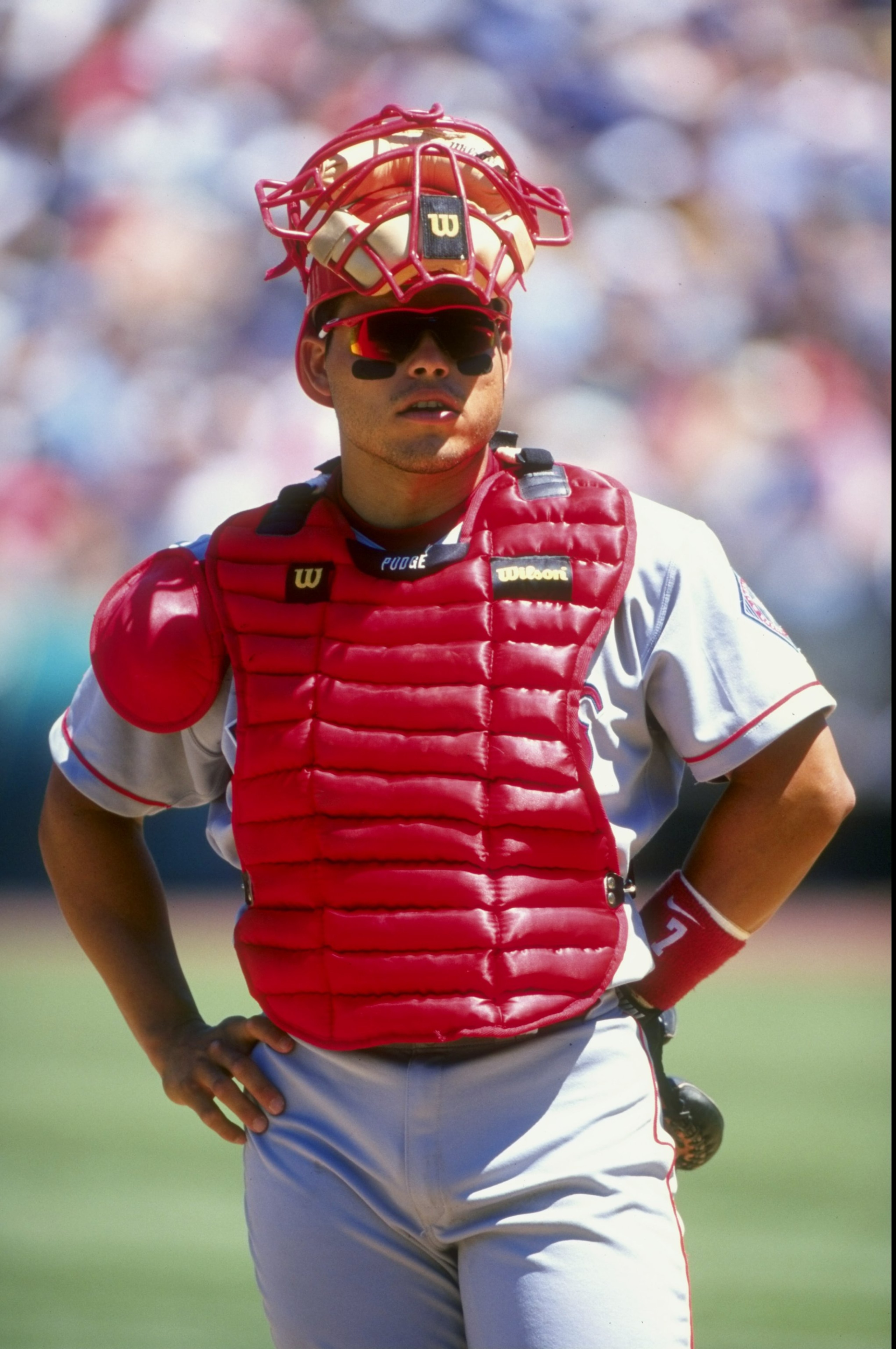 12 Jul 1998:  Catcher Ivan Rodriguez #7 of the Texas Rangers standing there looking on during the game against the Oakland Athletics at the Oakland Coliseum in Oakland, California. The Athletics defeated the Rangers 7-5.