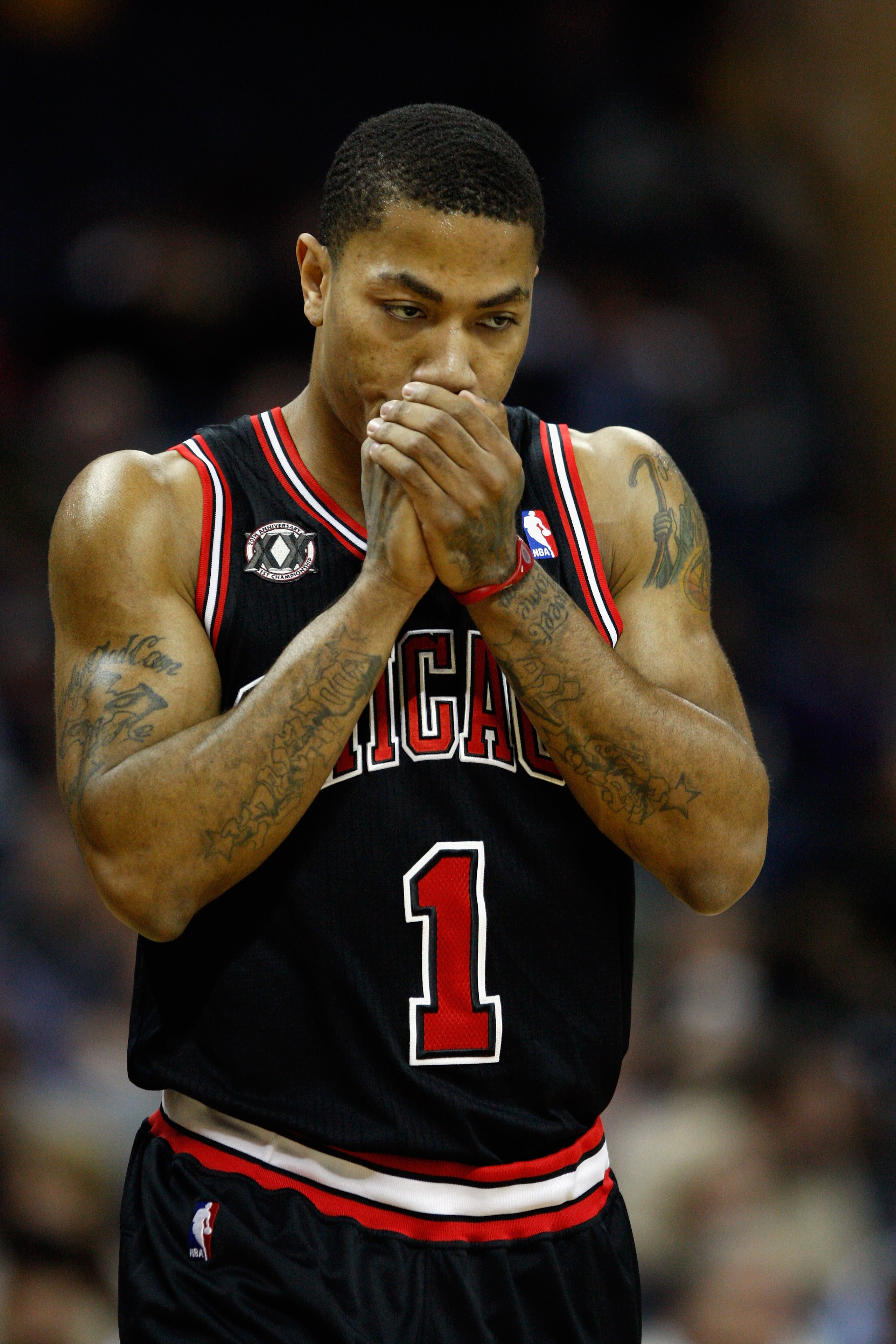 CHARLOTTE, NC - JANUARY 12:  Derrick Rose #1 of the Chicago Bulls prepares for his game against Charlotte Bobcats at Time Warner Cable Arena on January 12, 2011 in Charlotte, North Carolina. NOTE TO USER: User expressly acknowledges and agrees that, by do