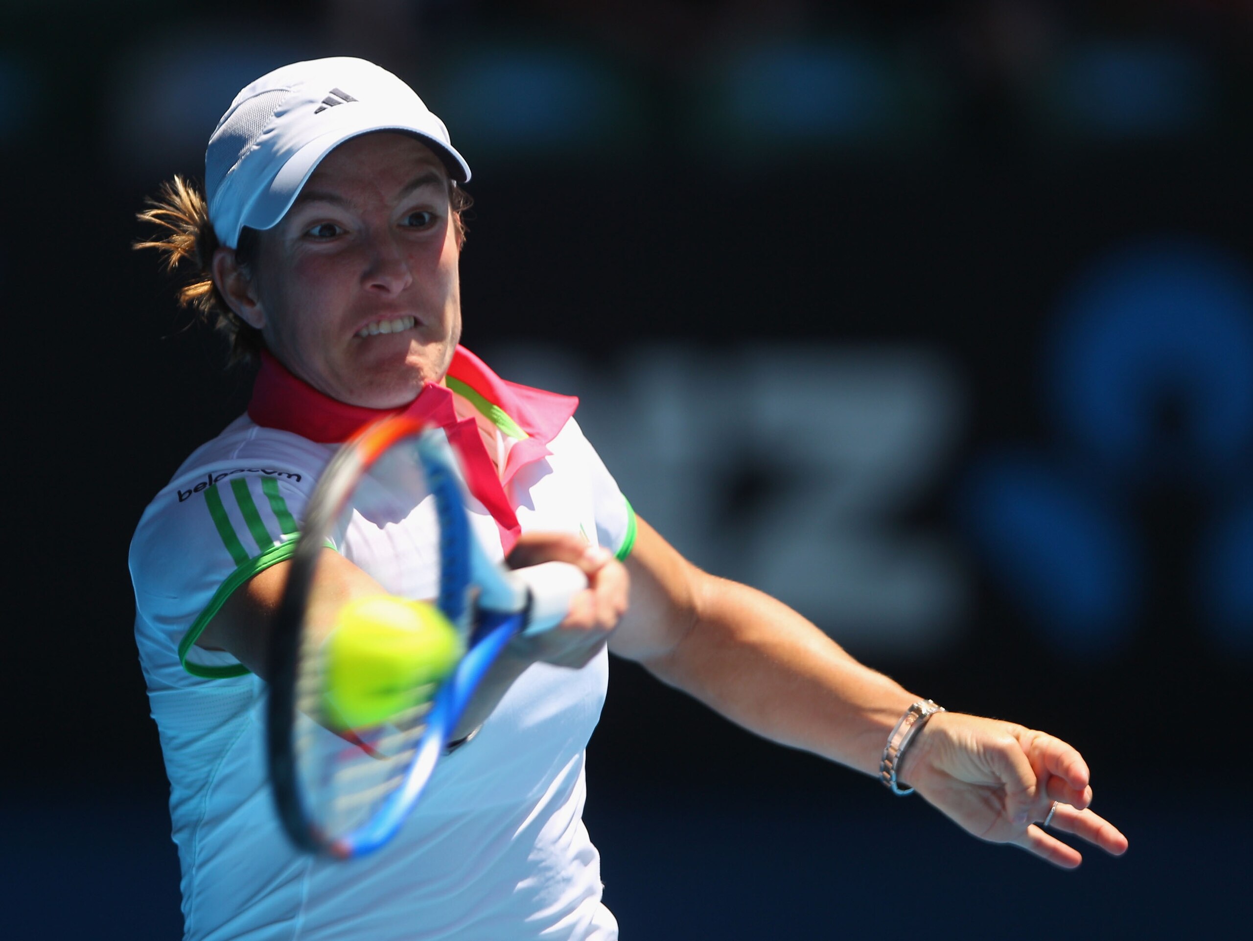 MELBOURNE, AUSTRALIA - JANUARY 21:  Justine Henin of Belgium plays a forehand in her third round match against Svetlana Kuznetsova of Russia during day five of the 2011 Australian Open at Melbourne Park on January 21, 2011 in Melbourne, Australia.  (Photo