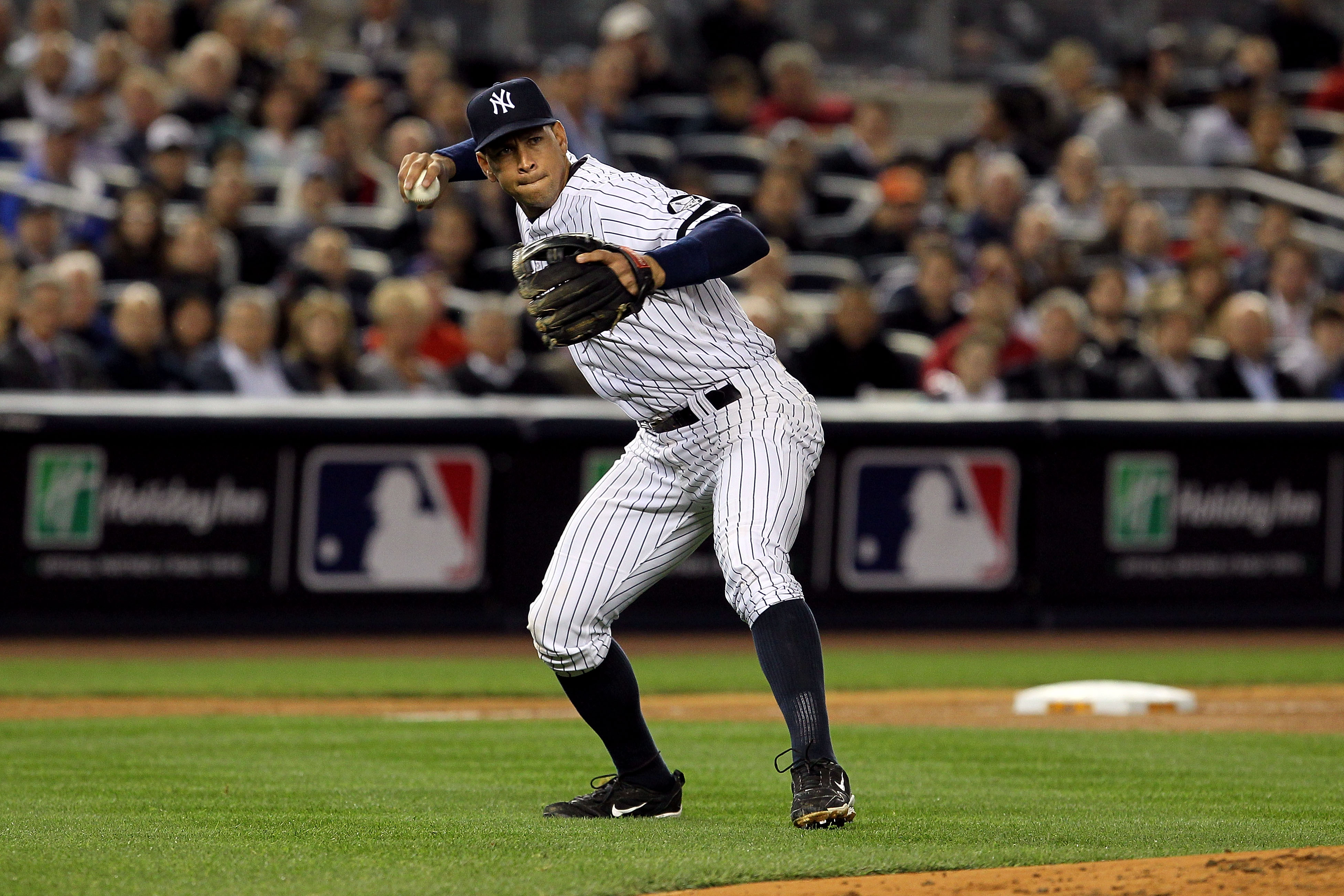 NEW YORK - OCTOBER 19:  Alex Rodriguez #13 of the New York Yankees throws the ball to first base against the Texas Rangers in Game Four of the ALCS during the 2010 MLB Playoffs at Yankee Stadium on October 19, 2010 in the Bronx borough of New York City.