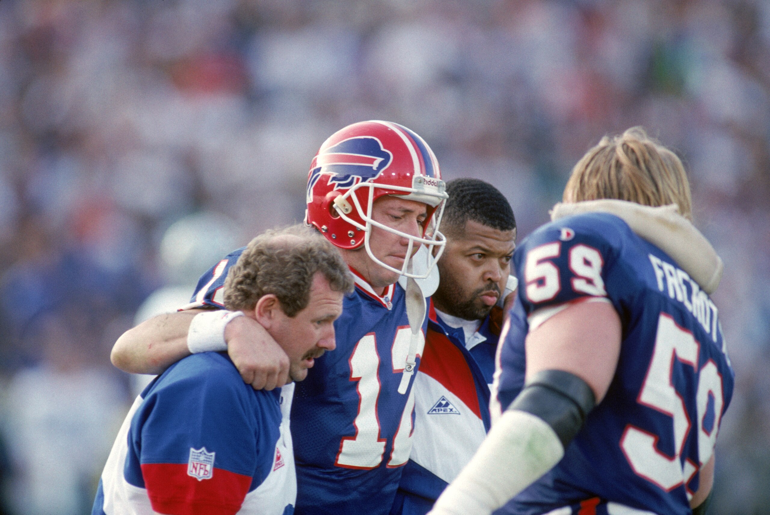 PASADENA, CA - JANUARY 31:  Quarterback Jim Kelly #12 of the Buffalo Bills leaves the game after a knee injury in the second quarter of Super Bowl XXVII against the Dallas Cowboys at the Rose Bowl on January 31, 1993 in Pasadena, California.  The Cowboys