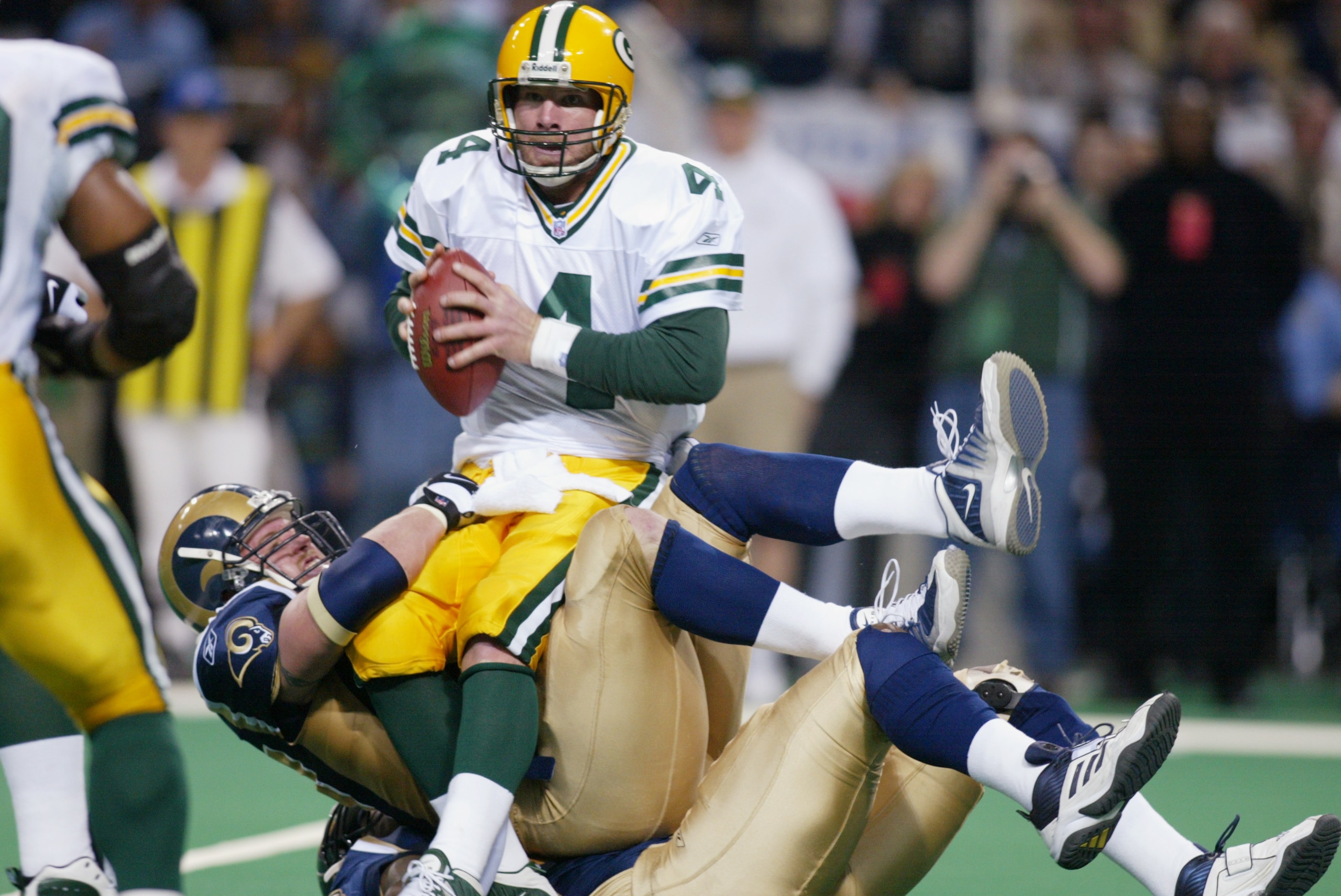 20 Jan 2002 : Quarterback Brett Favre #4 of the Green Bay Packers is stopped by the St.Louis Rams during the game at the Dome at America's Center in St.Louis, Missouri. The Rams won 45-17. DIGITAL IMAGE. Mandatory Credit: Tom Hauck/Getty Images