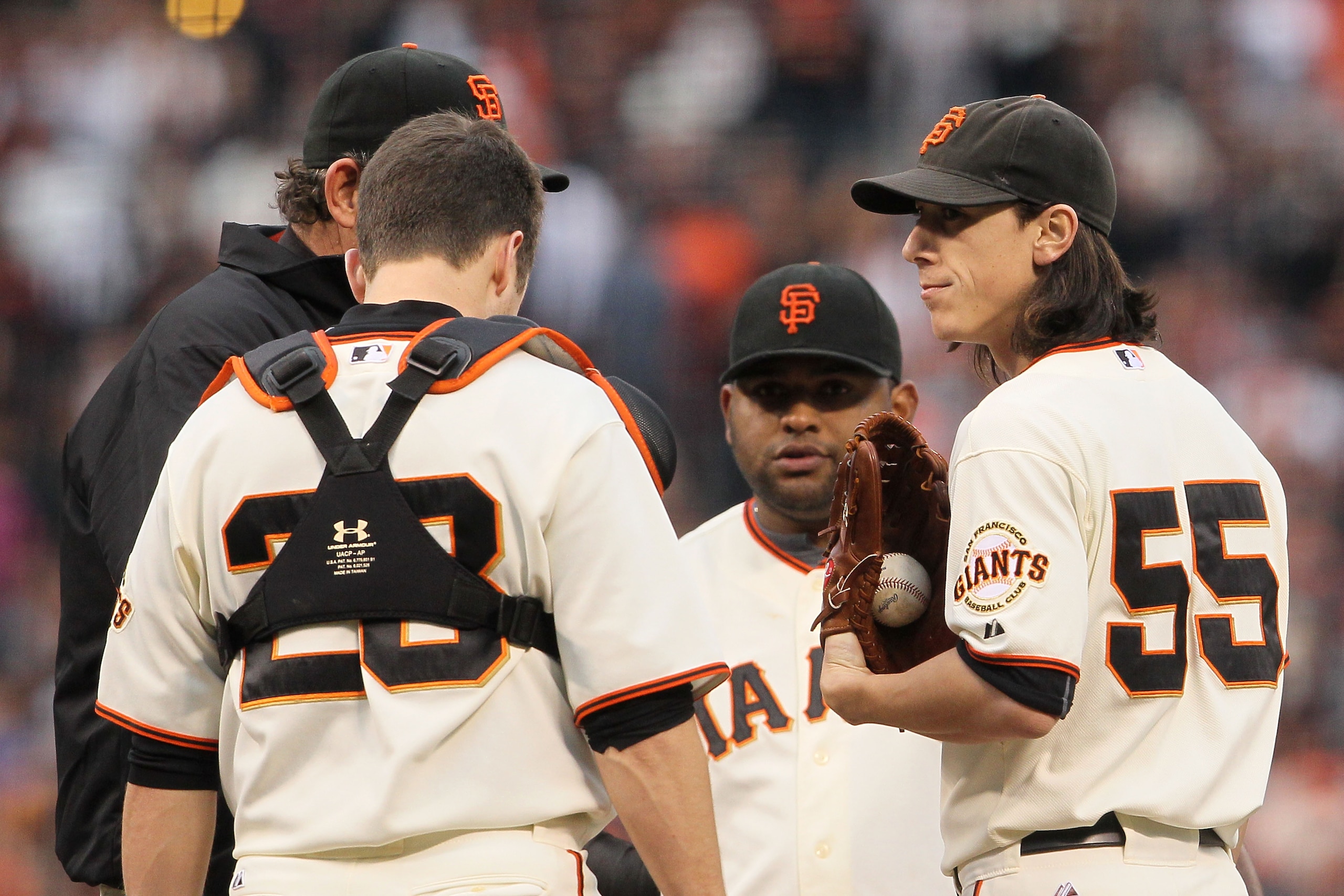 SAN FRANCISCO - OCTOBER 21:  Tim Lincecum #55 (R) of the San Francisco Giants stands on the mound during a meeting with pitching coach Dave Righetti in the third inning of Game Five of the NLCS against the Philadelphia Phillies during the 2010 MLB Playoff