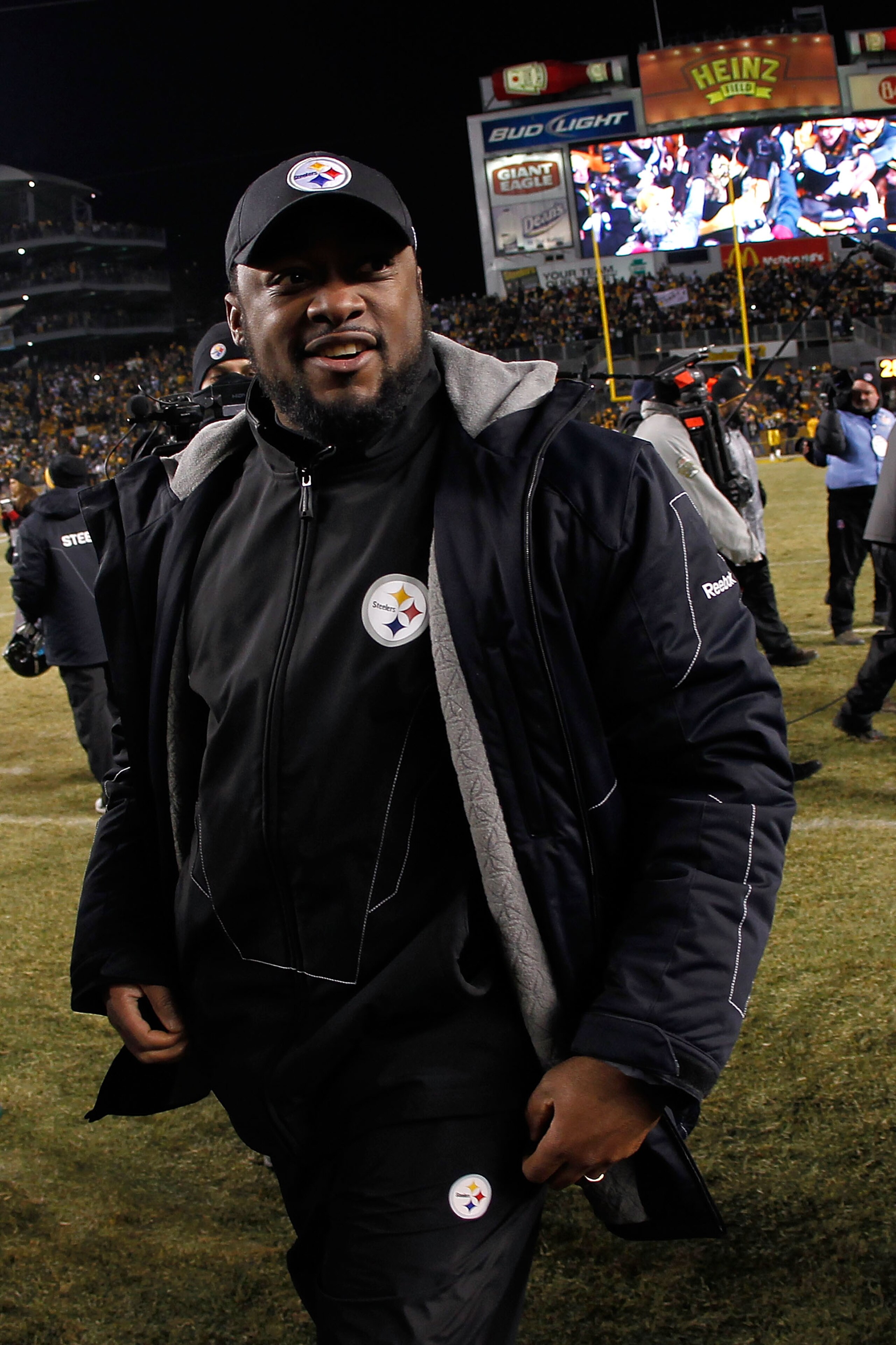 PITTSBURGH, PA - JANUARY 23:  Head coach Mike Tomlin of the Pittsburgh Steelers celebrates their 24 to 19 win over the New York Jets in the 2011 AFC Championship game at Heinz Field on January 23, 2011 in Pittsburgh, Pennsylvania.  (Photo by Gregory Shamu