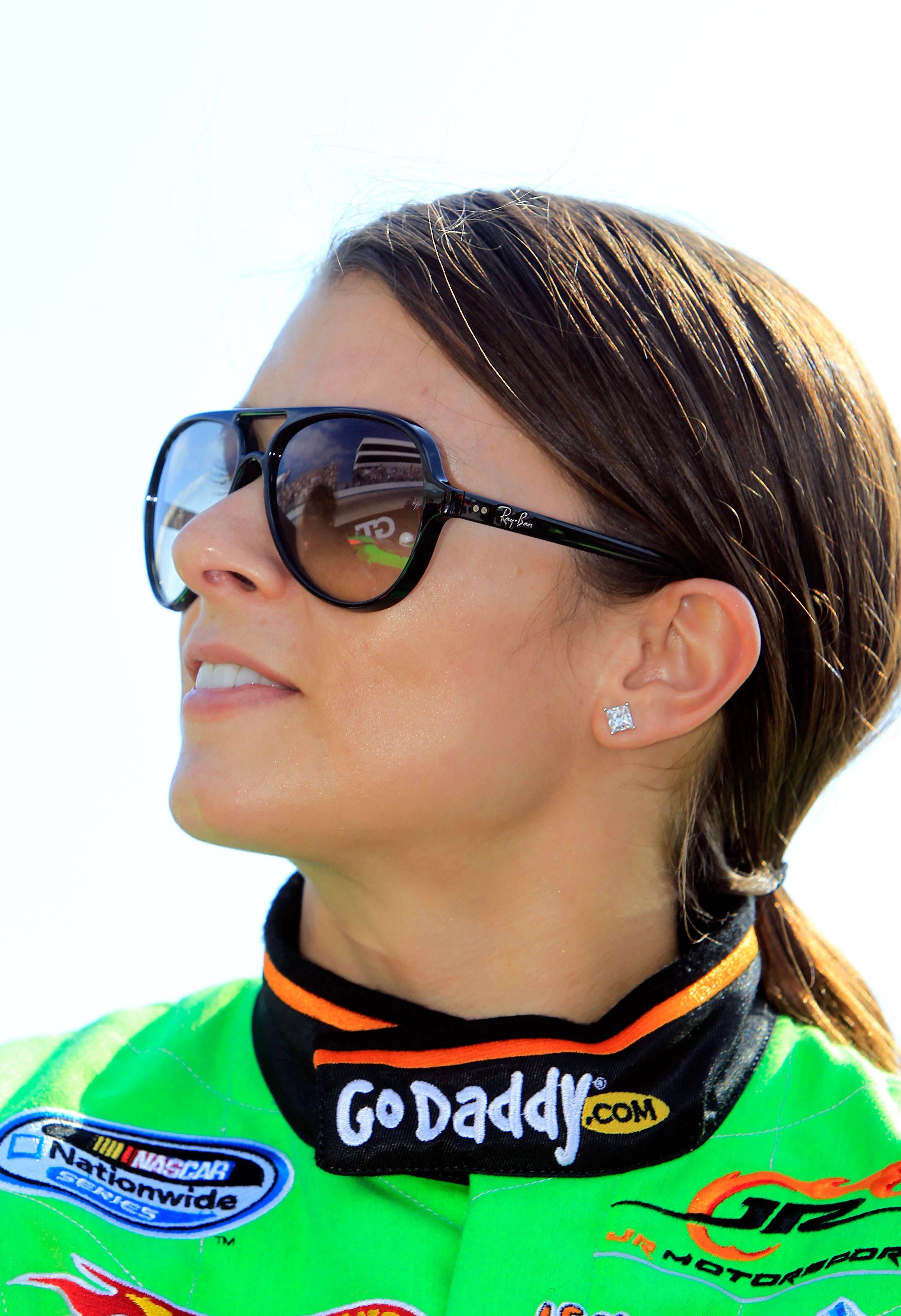 DOVER, DE - SEPTEMBER 25:  Danica Patrick, driver of the #7 GoDaddy.com Chevrolet, stands on the grid prior to the NASCAR Nationwide Series Dover 200 at Dover International Speedway on September 25, 2010 in Dover, Delaware.  (Photo by Chris Trotman/Getty