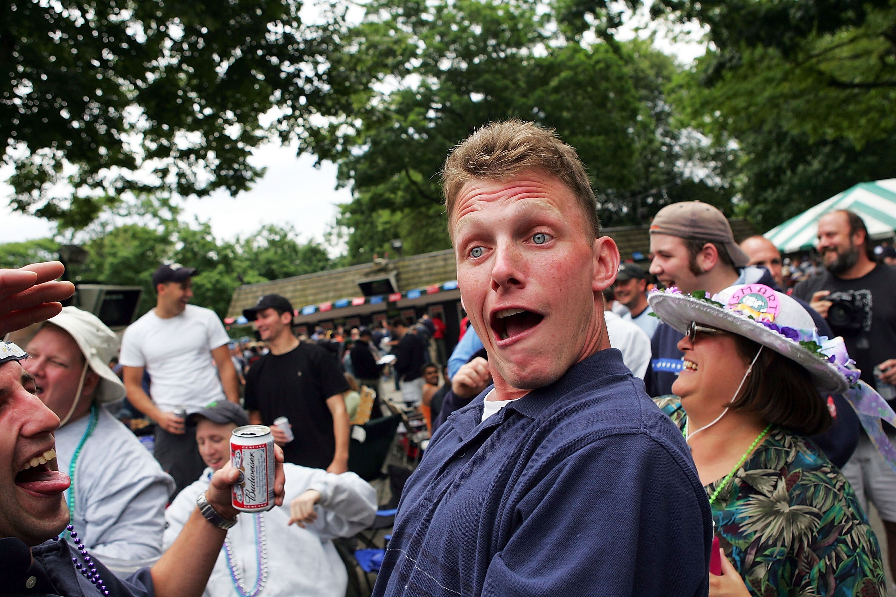 ELMONT, NEW YORK - JUNE 5:  A fan gets a little drunk after drinking beer funnels before the running of the races on June 5, 2004 at the 136th Belmont Stakes in Elmont, New York.  (Photo by Ezra Shaw/Getty Images)