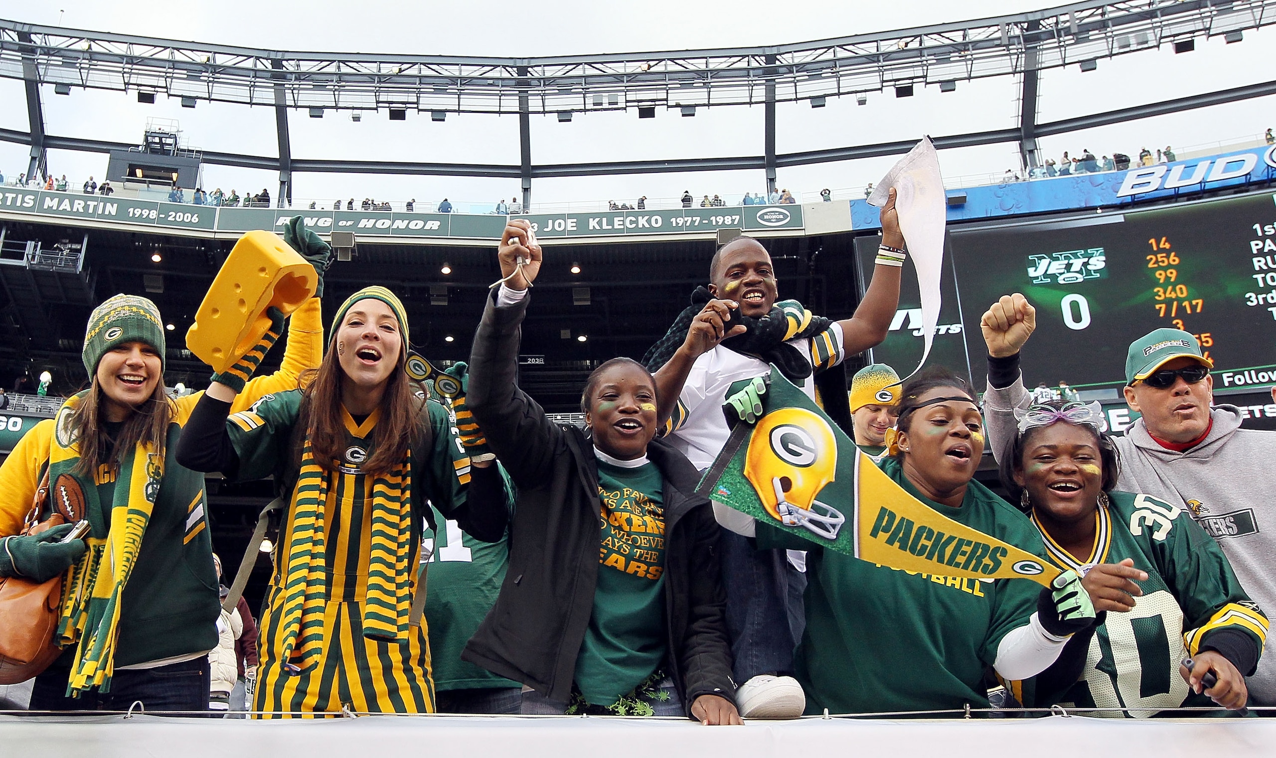 EAST RUTHERFORD, NJ - OCTOBER 31:  Fans of the Green Bay Packers celebrate after their team defeated the New York Jets on October 31, 2010 at the New Meadowlands Stadium in East Rutherford, New Jersey. The Packers defeated the Jets 9-0.  (Photo by Jim McI