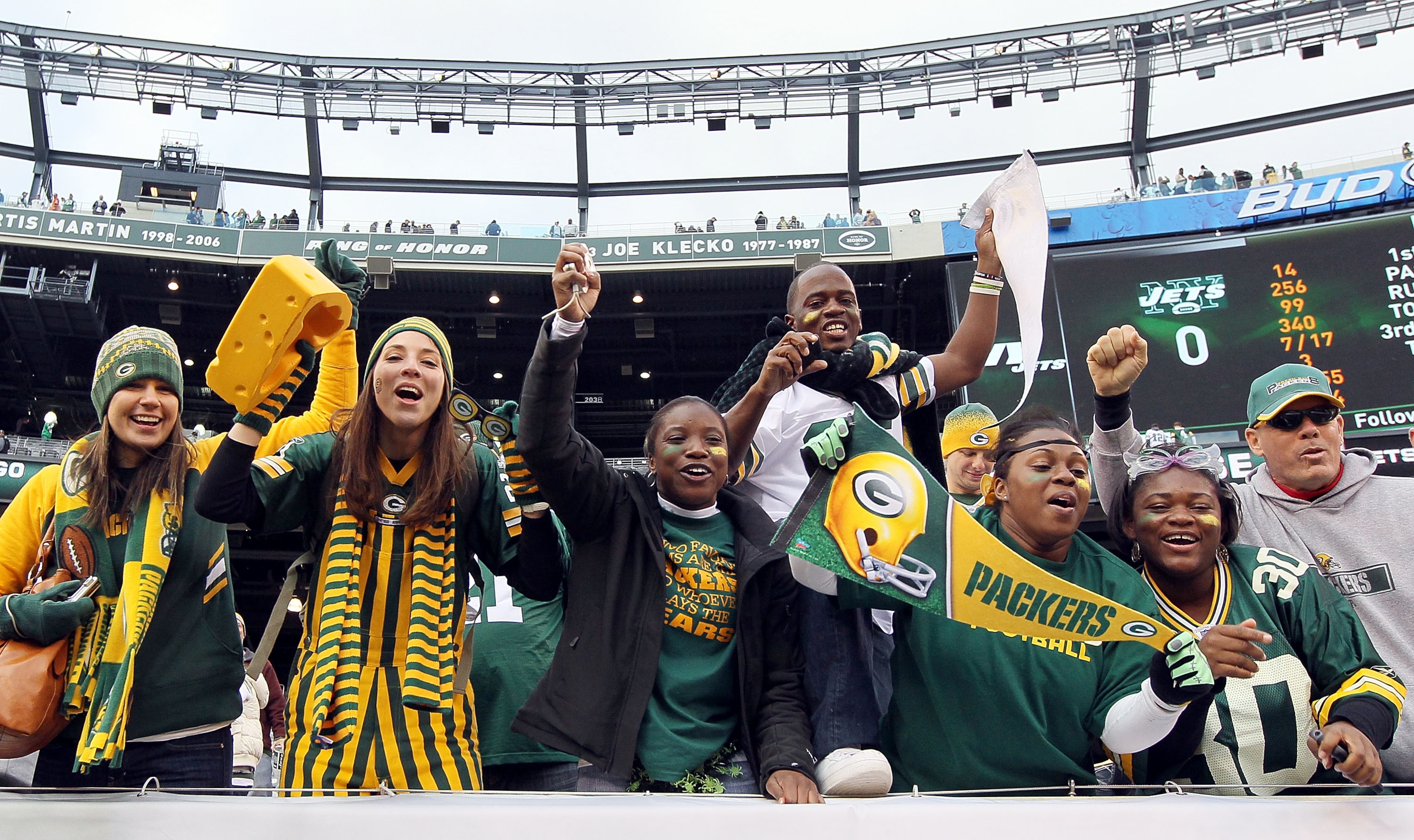EAST RUTHERFORD, NJ - OCTOBER 31:  Fans of the Green Bay Packers celebrate after their team defeated the New York Jets on October 31, 2010 at the New Meadowlands Stadium in East Rutherford, New Jersey. The Packers defeated the Jets 9-0.  (Photo by Jim McI