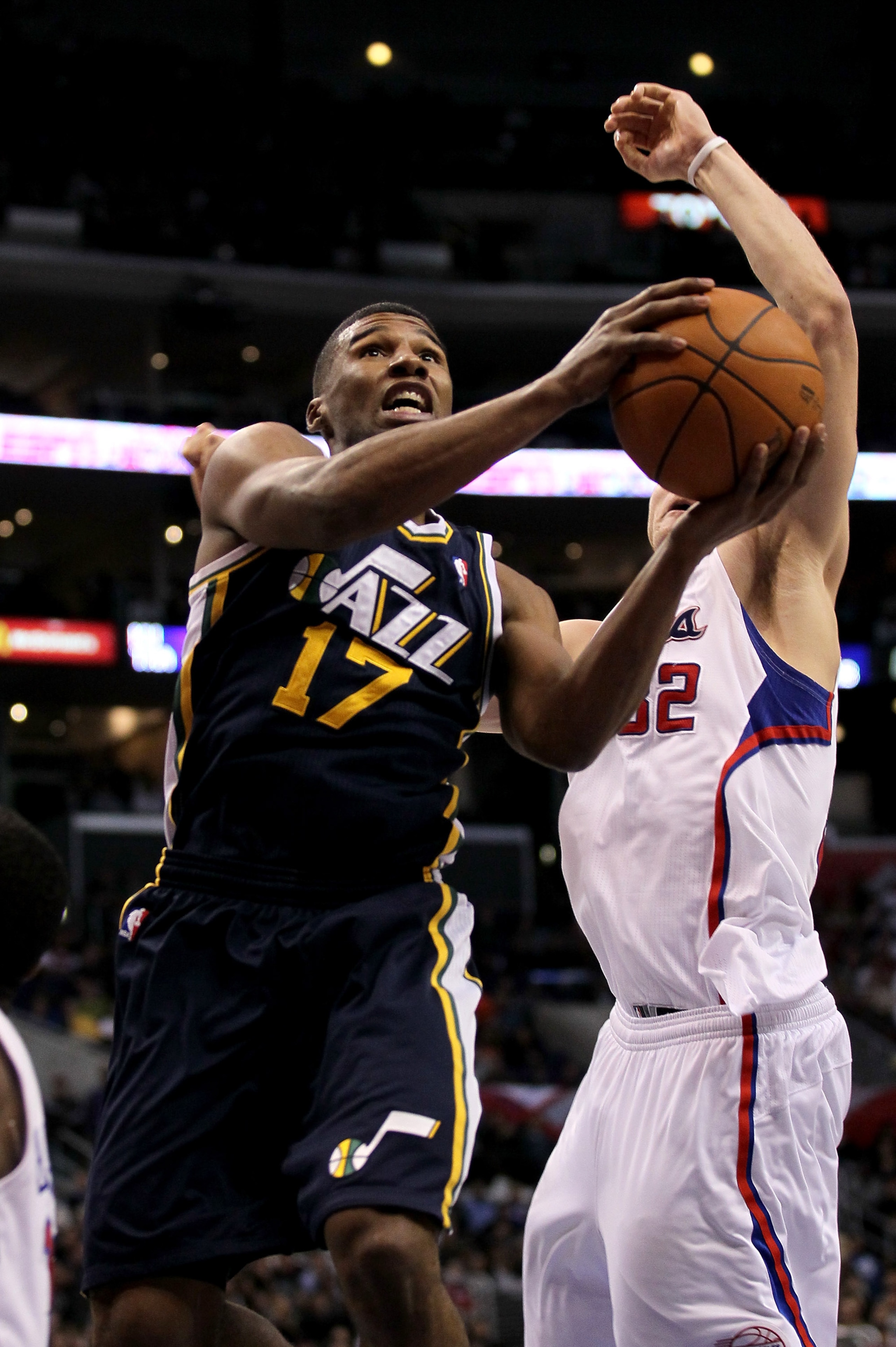 LOS ANGELES, CA - DECEMBER 29: Ronnie Price #17 of the Utah Jazz shoots over Blake Griffin #32 of the Los Angeles Clippers at Staples Center on December 29, 2010 in Los Angeles, California. The Jazz won 103-85. NOTE TO USER: User expressly acknowledge LOS ANGELES, CA - DECEMBER 29: Ronnie Price #17 of the Utah Jazz shoots over Blake Griffin #32 of the Los Angeles Clippers at Staples Center on December 29, 2010 in Los Angeles, California. The Jazz won 103-85. NOTE TO USER: User expressly acknowledge