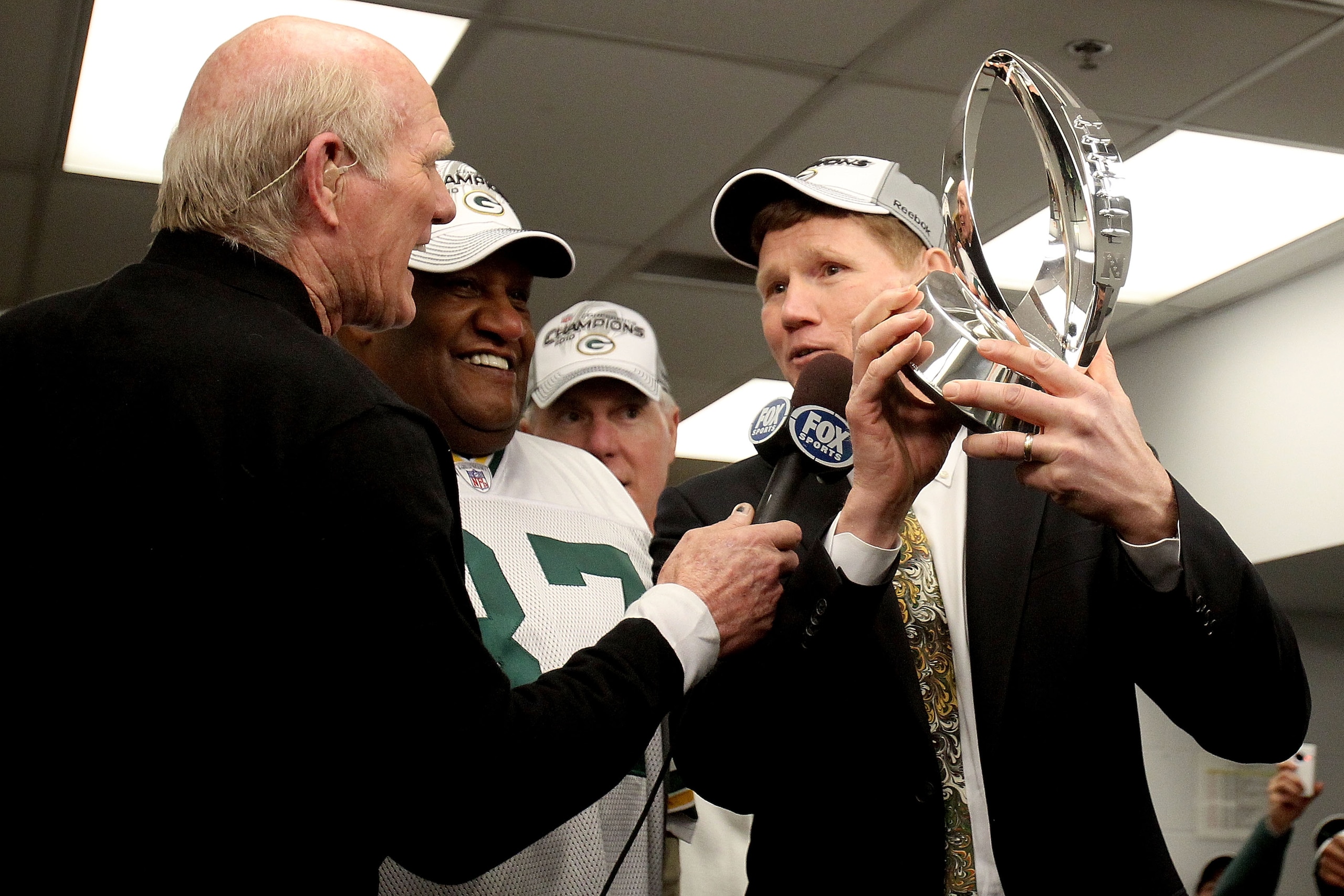 CHICAGO, IL - JANUARY 23:  Green Bay Packers president Mark Murphy holds the George Halas Trophy as he is interviewed by Fox's Terry Bradshaw after the Packers 21-14 victory against the Chicago Bears in the NFC Championship Game at Soldier Field on Januar