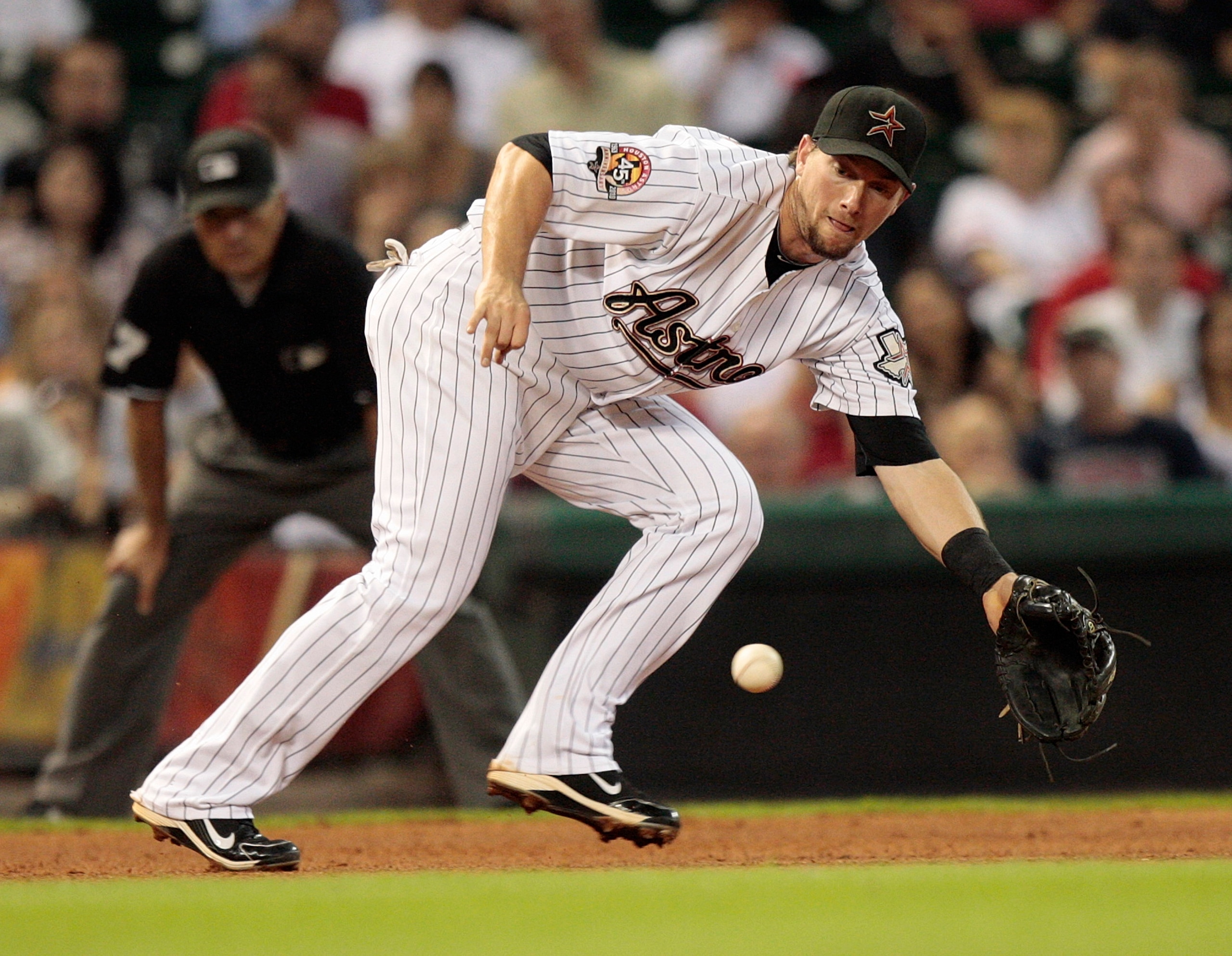HOUSTON - AUGUST 31:  Third baseman Chris Johnson #23 of the Houston Astros fields a ground ball against the St. Louis Cardinals at Minute Maid Park on August 31, 2010 in Houston, Texas.  (Photo by Bob Levey/Getty Images)