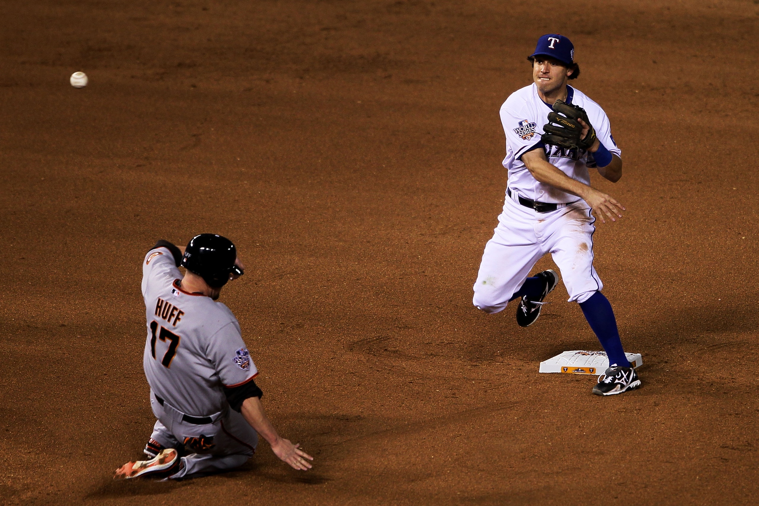 ARLINGTON, TX - NOVEMBER 01: Aubrey Huff #17 of the San Francisco Giants is out at second as Ian Kinsler #5 of the Texas Rangers turns a double play in the fifth inning of Game Five of the 2010 MLB World Series at Rangers Ballpark in Arlington on Novembe ARLINGTON, TX - NOVEMBER 01: Aubrey Huff #17 of the San Francisco Giants is out at second as Ian Kinsler #5 of the Texas Rangers turns a double play in the fifth inning of Game Five of the 2010 MLB World Series at Rangers Ballpark in Arlington on Novembe