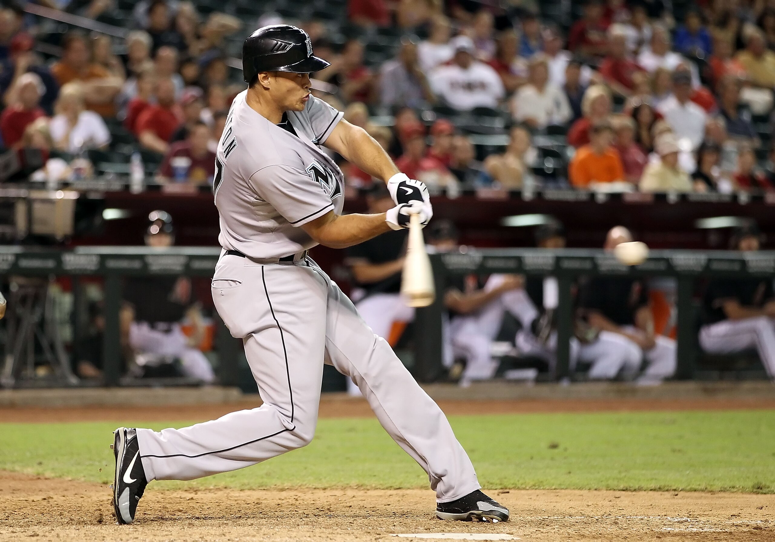 PHOENIX - JULY 10:  Mike Stanton #27 of the Florida Marlins hits a double against the Arizona Diamondbacks during the ninth inning of the Major League Baseball game at Chase Field on July 10, 2010 in Phoenix, Arizona. The Diamondbacks defeated the Marlins