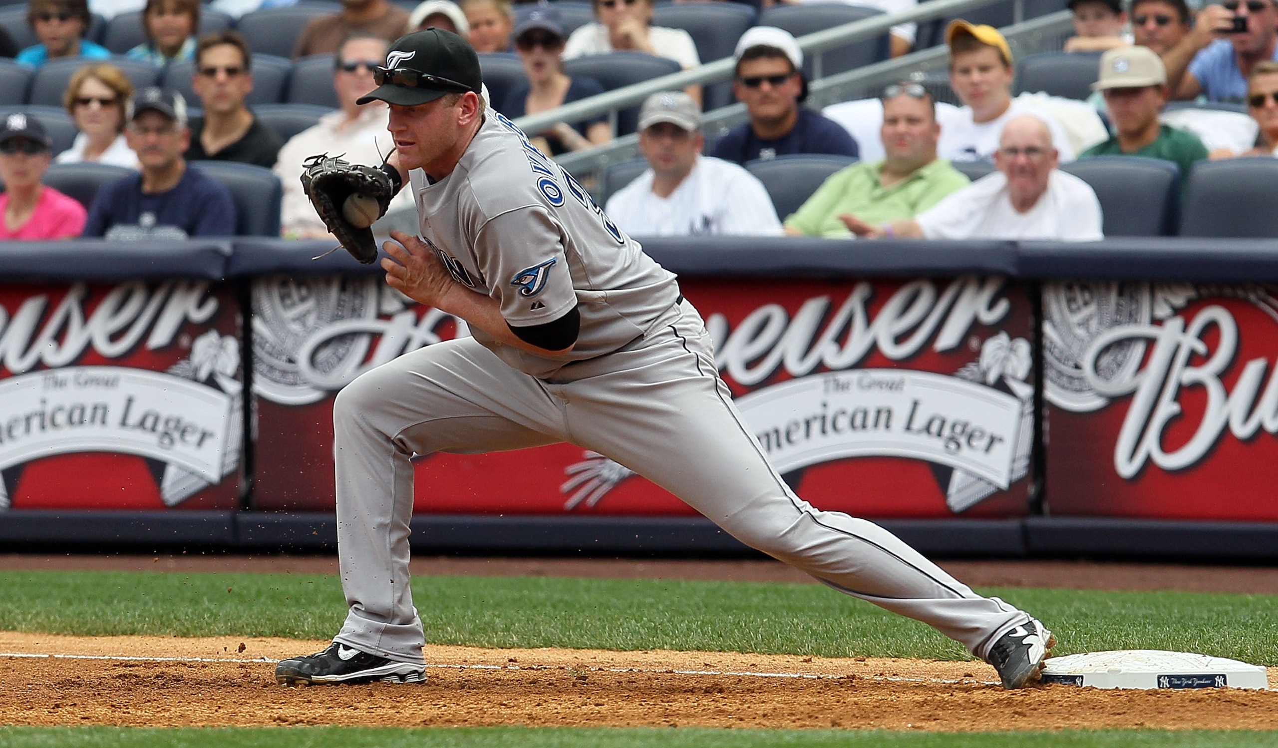 NEW YORK - AUGUST 04: Lyle Overbay #35 of the Toronto Blue Jays fields the ball against the New York Yankees on August 4, 2010 at Yankee Stadium in the Bronx borough of New York City. (Photo by Jim McIsaac/Getty Images) NEW YORK - AUGUST 04: Lyle Overbay #35 of the Toronto Blue Jays fields the ball against the New York Yankees on August 4, 2010 at Yankee Stadium in the Bronx borough of New York City. (Photo by Jim McIsaac/Getty Images)