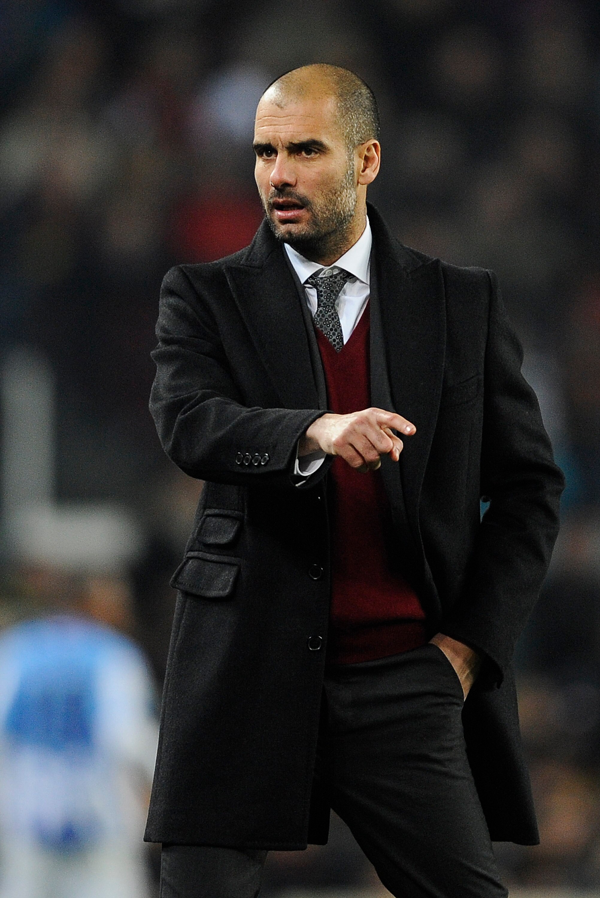 BARCELONA, SPAIN - JANUARY 16:  Head coach Josep Guardila of FC Barcelona reacts during the La Liga match between FC Barcelona and Malaga at Nou Camp on January 16, 2011 in Barcelona, Spain. Barcelona won 4-1.  (Photo by David Ramos/Getty Images)