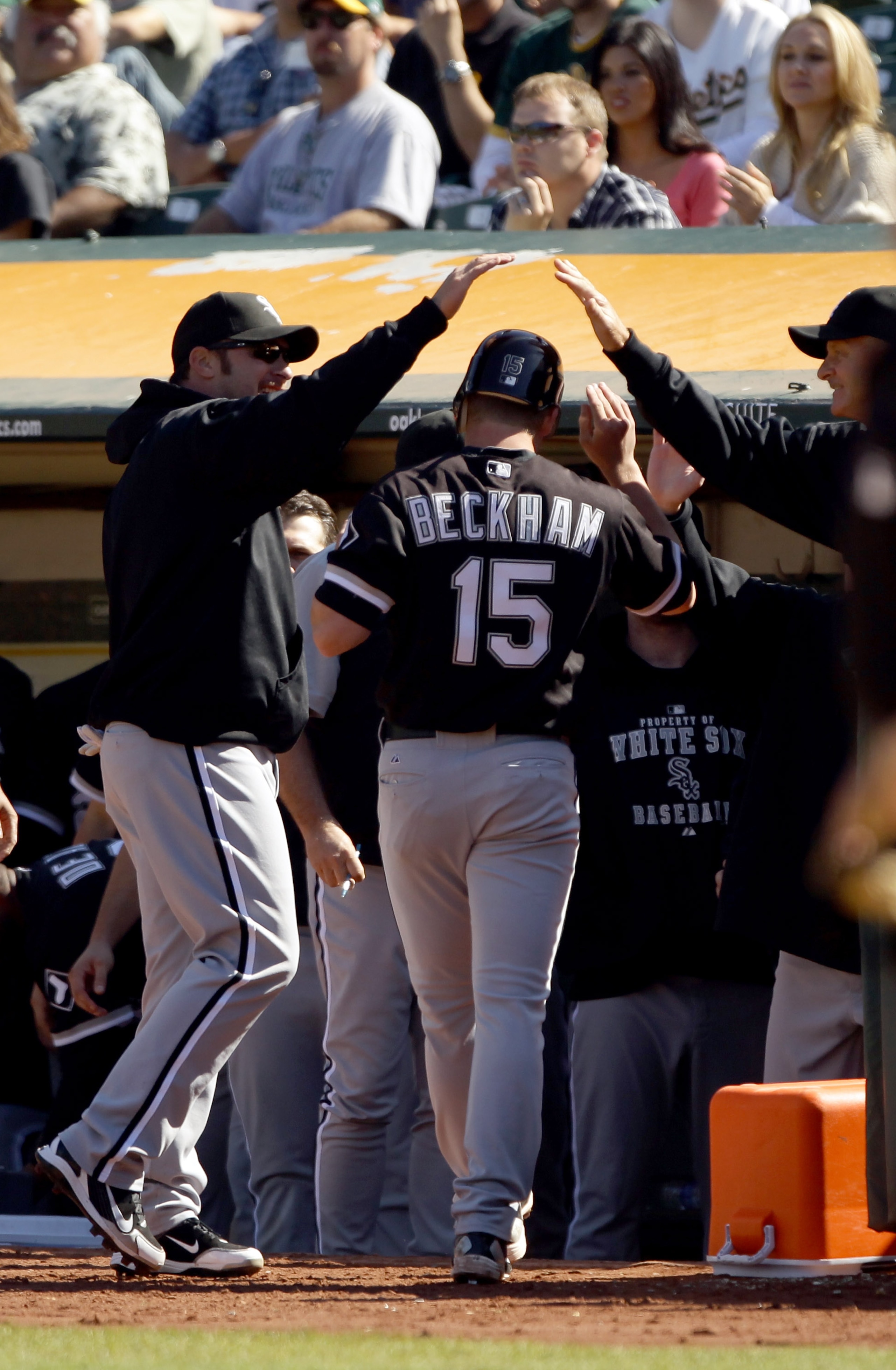 OAKLAND, CA - SEPTEMBER 22: Gordon Beckham #15 of the Chicago White Sox is congratulated by teammates after he scored on a double by Mark Teahen #23 in the ninth inning to give the White Sox a 4-3 over the Oakland Athletics at the Oakland-Alameda County OAKLAND, CA - SEPTEMBER 22: Gordon Beckham #15 of the Chicago White Sox is congratulated by teammates after he scored on a double by Mark Teahen #23 in the ninth inning to give the White Sox a 4-3 over the Oakland Athletics at the Oakland-Alameda County