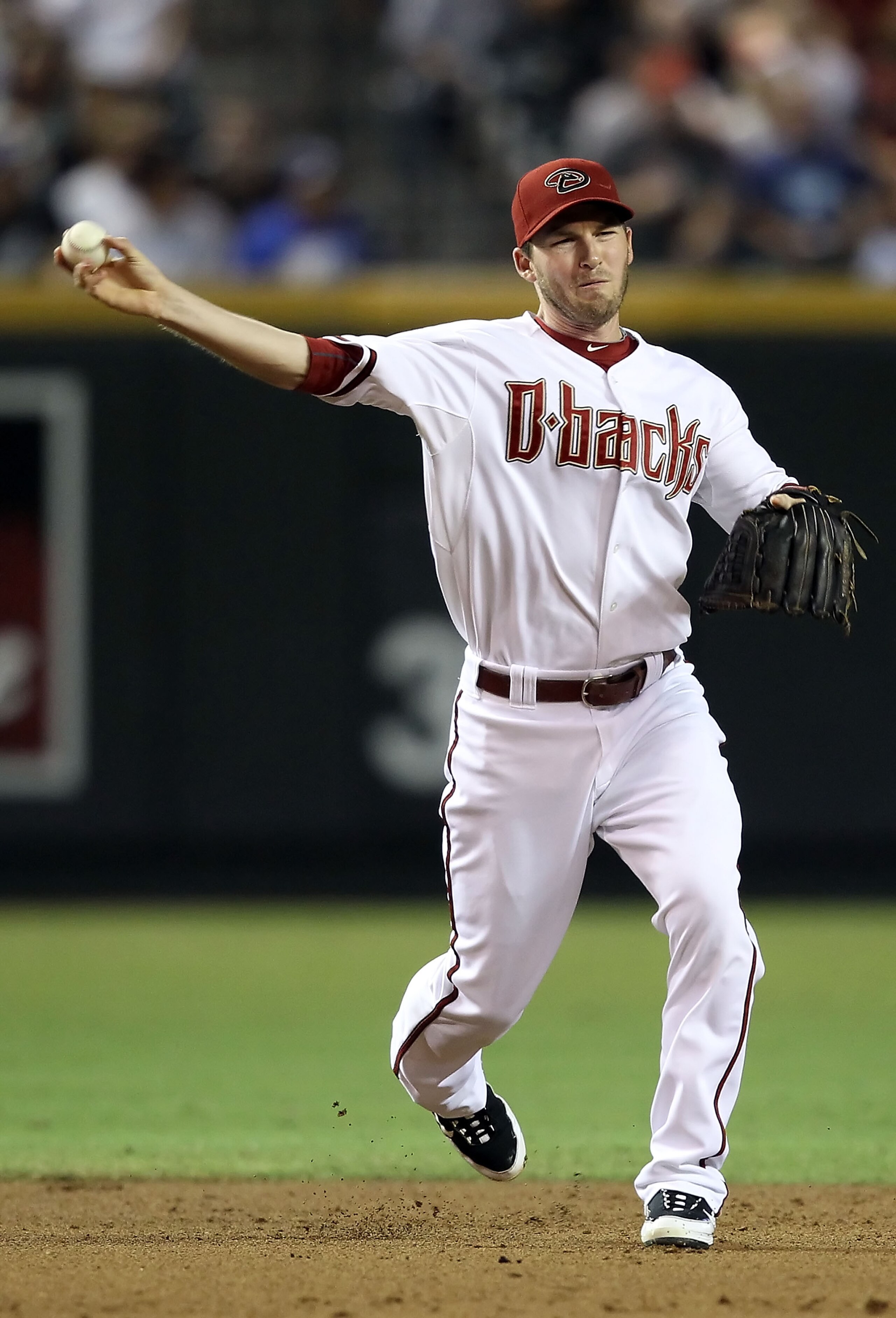 PHOENIX - SEPTEMBER 24: Infielder Stephen Drew #6 of the Arizona Diamondbacks fields a ground ball out during the Major League Baseball game against the Los Angeles Dodgers at Chase Field on September 24, 2010 in Phoenix, Arizona. (Photo by Christian Pe PHOENIX - SEPTEMBER 24: Infielder Stephen Drew #6 of the Arizona Diamondbacks fields a ground ball out during the Major League Baseball game against the Los Angeles Dodgers at Chase Field on September 24, 2010 in Phoenix, Arizona. (Photo by Christian Pe