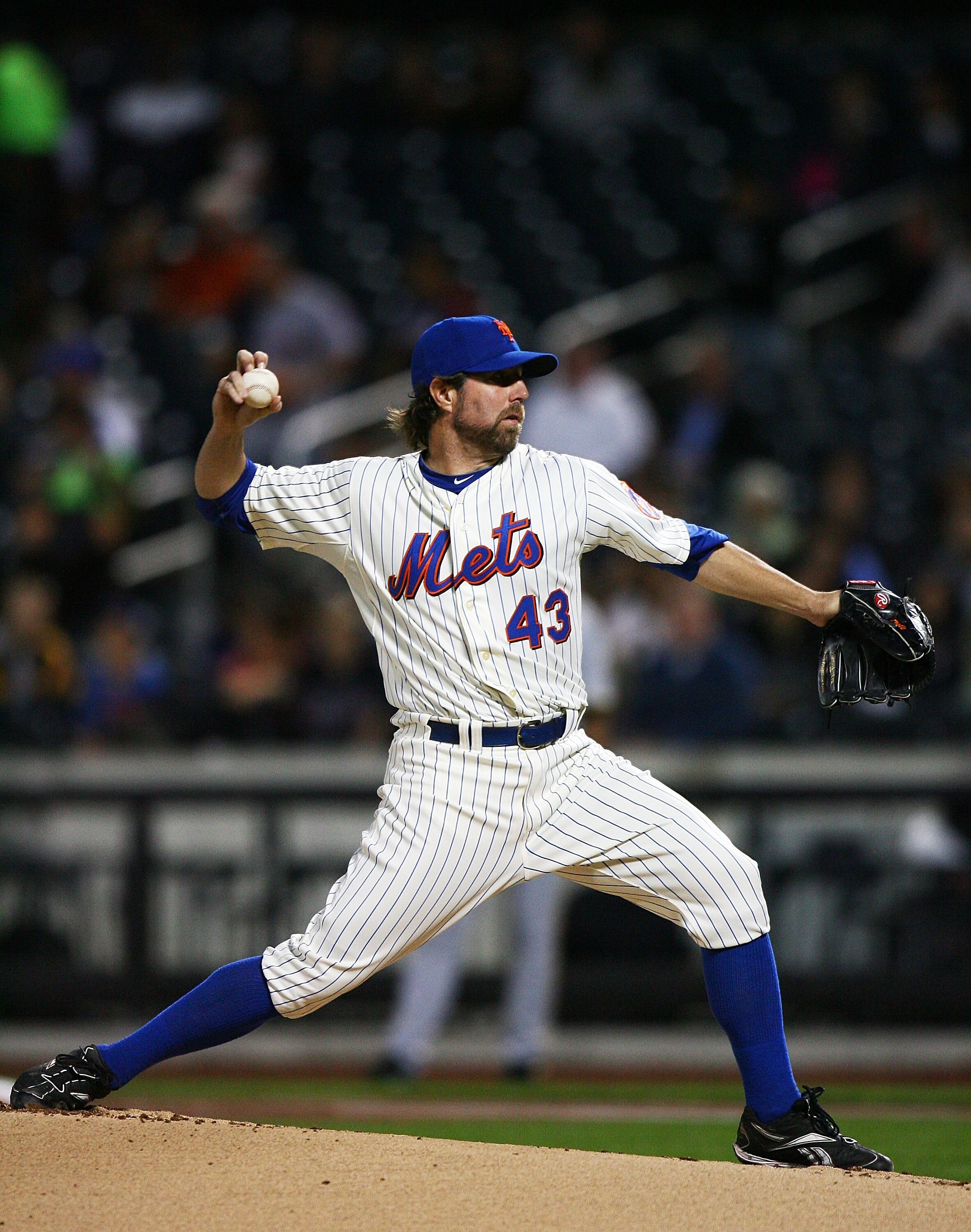 NEW YORK - SEPTEMBER 14:  R.A. Dickey #43 of the New York Mets pitches against the Pittsburgh Pirates on September 14, 2010 at Citi Field in the Flushing neighborhood of the Queens borough of New York City.  (Photo by Andrew Burton/Getty Images)