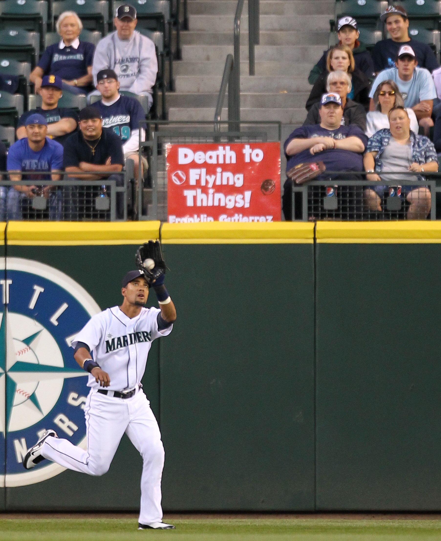 SEATTLE - AUGUST 03:  Center fielder Franklin Gutierrez #21 of the Seattle Mariners makes a catch against the Texas Rangers at Safeco Field on August 3, 2010 in Seattle, Washington. (Photo by Otto Greule Jr/Getty Images)