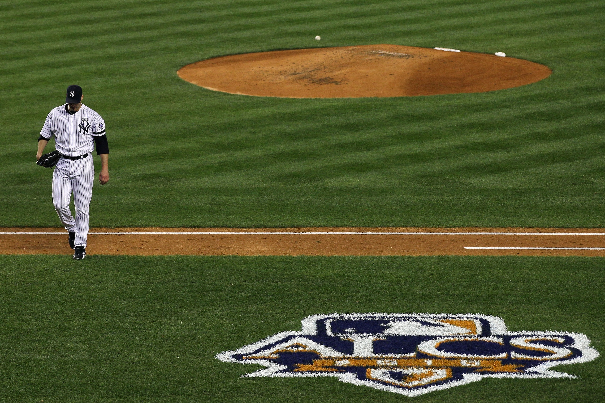 NEW YORK - OCTOBER 18: Andy Pettitte #46 of the New York Yankees walks back to the dugout at the end of the top of the second inning against the Texas Rangers in Game Three of the ALCS during the 2010 MLB Playoffs at Yankee Stadium on October 18, 2010 in NEW YORK - OCTOBER 18: Andy Pettitte #46 of the New York Yankees walks back to the dugout at the end of the top of the second inning against the Texas Rangers in Game Three of the ALCS during the 2010 MLB Playoffs at Yankee Stadium on October 18, 2010 in
