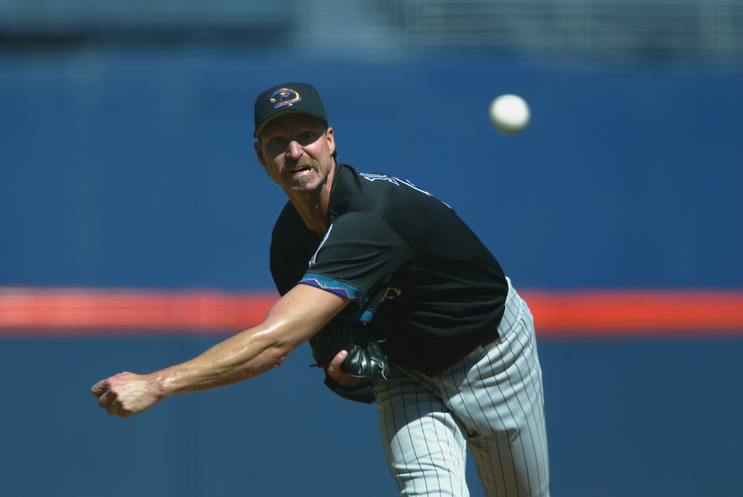 SAN DIEGO - September 19:  Left-Hander Randy Johnson #51 of the Arizona Diamondbacks pitches against the San Diego Padres during their game on September 19, 2002 at Qualcomm Stadium in San Diego, California.  (Photo by Donald Miralle/Getty Images)