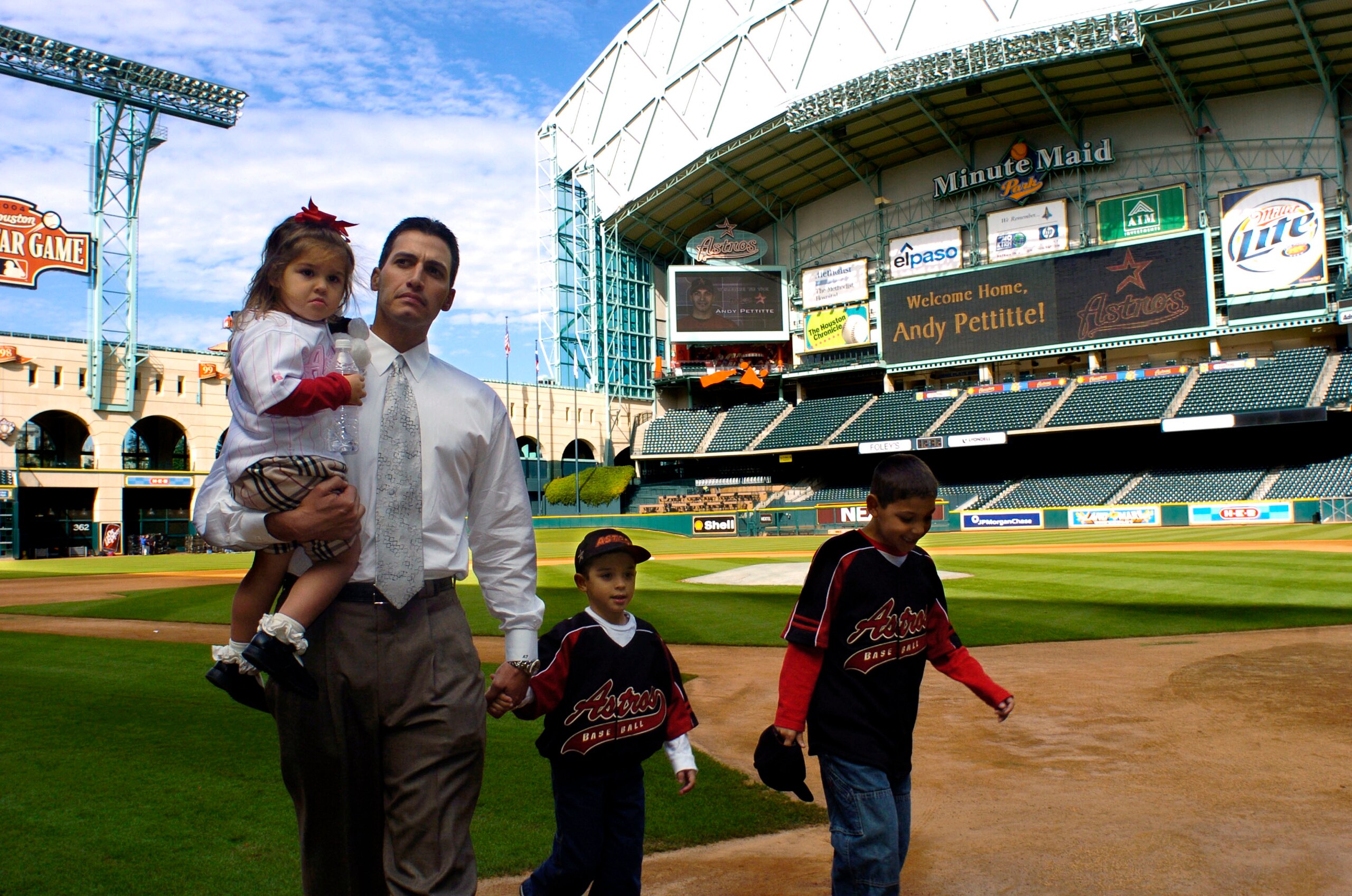 HOUSTON - DECEMBER 11: Former New York Yankees pitcher Andy Pettitte, holds his daughter, Lexy, 2, as he walks with his sons Jared, 5, and Joshua, 9, far right, as they walk on the field at Minute Maid Park following a news conference announcing him as t HOUSTON - DECEMBER 11: Former New York Yankees pitcher Andy Pettitte, holds his daughter, Lexy, 2, as he walks with his sons Jared, 5, and Joshua, 9, far right, as they walk on the field at Minute Maid Park following a news conference announcing him as t